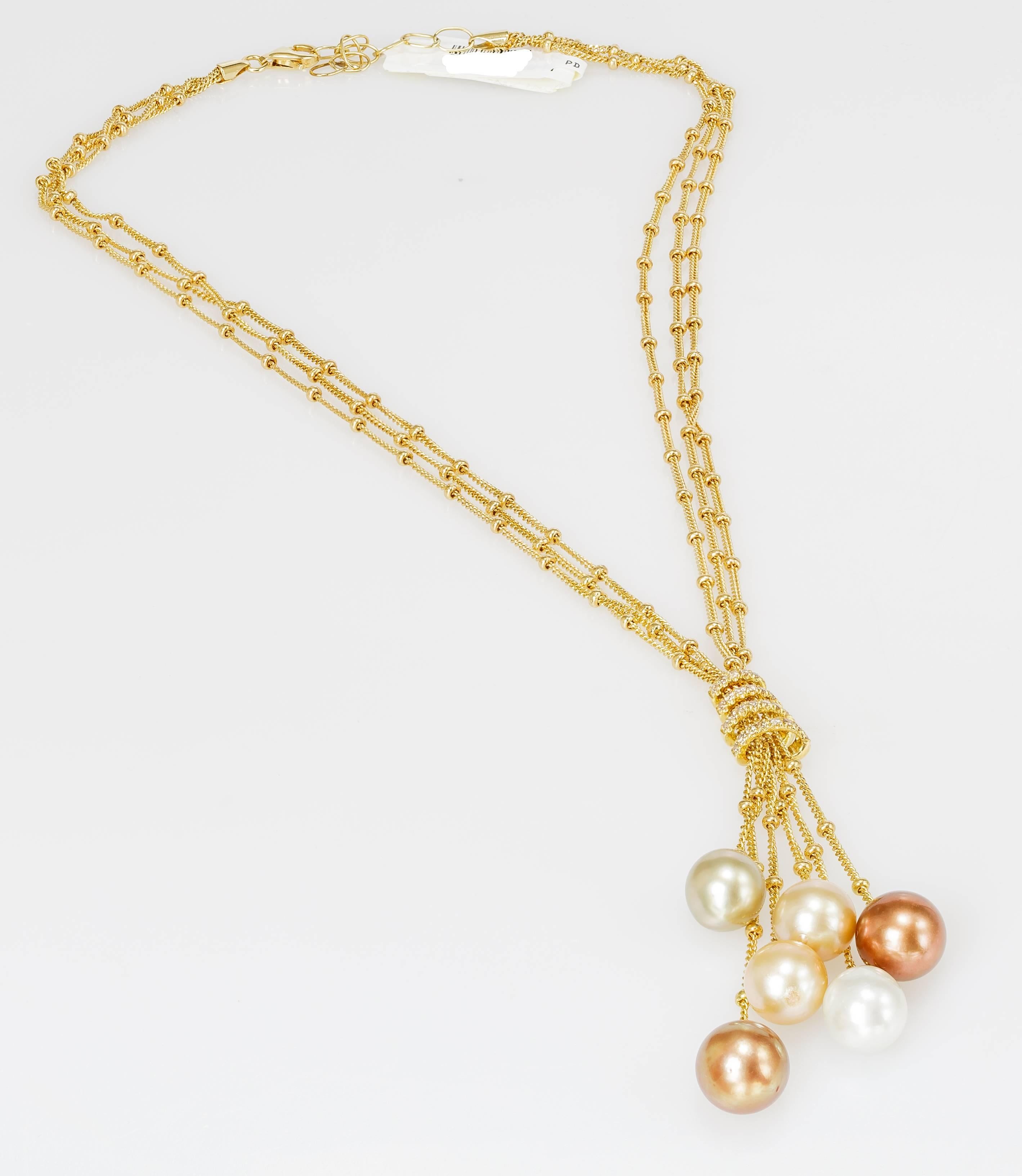 This Yvel necklace features six South Sea pearls hanging from 18k yellow gold and is set with diamonds totaling 0.26ct.  The chain measures 16 inches long.