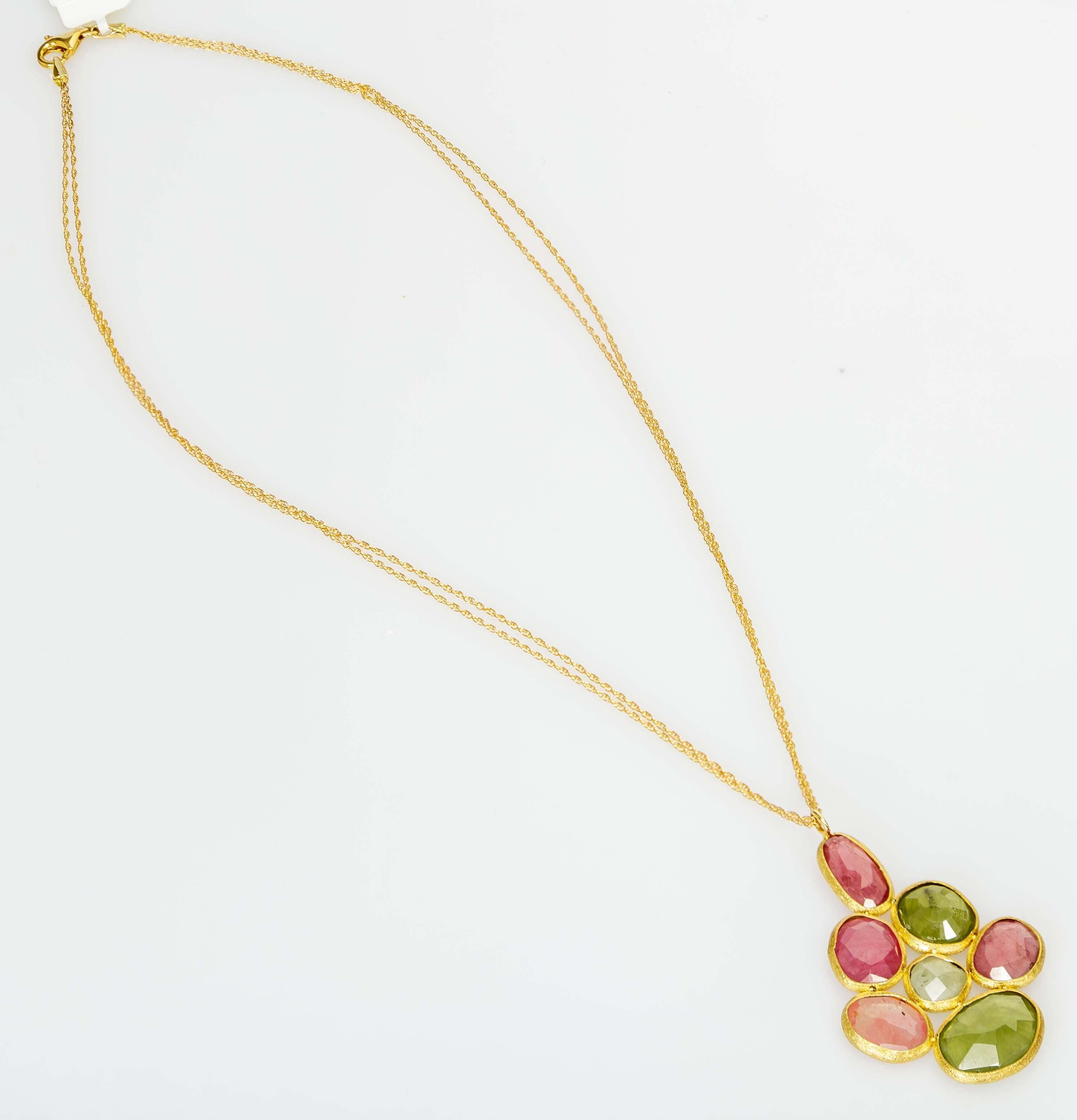This 16 inch Yvel 18k yellow gold multi-strand necklace features natural colored faceted sapphires in an 18k yellow gold pendant. The sapphires total 10.00 ct.