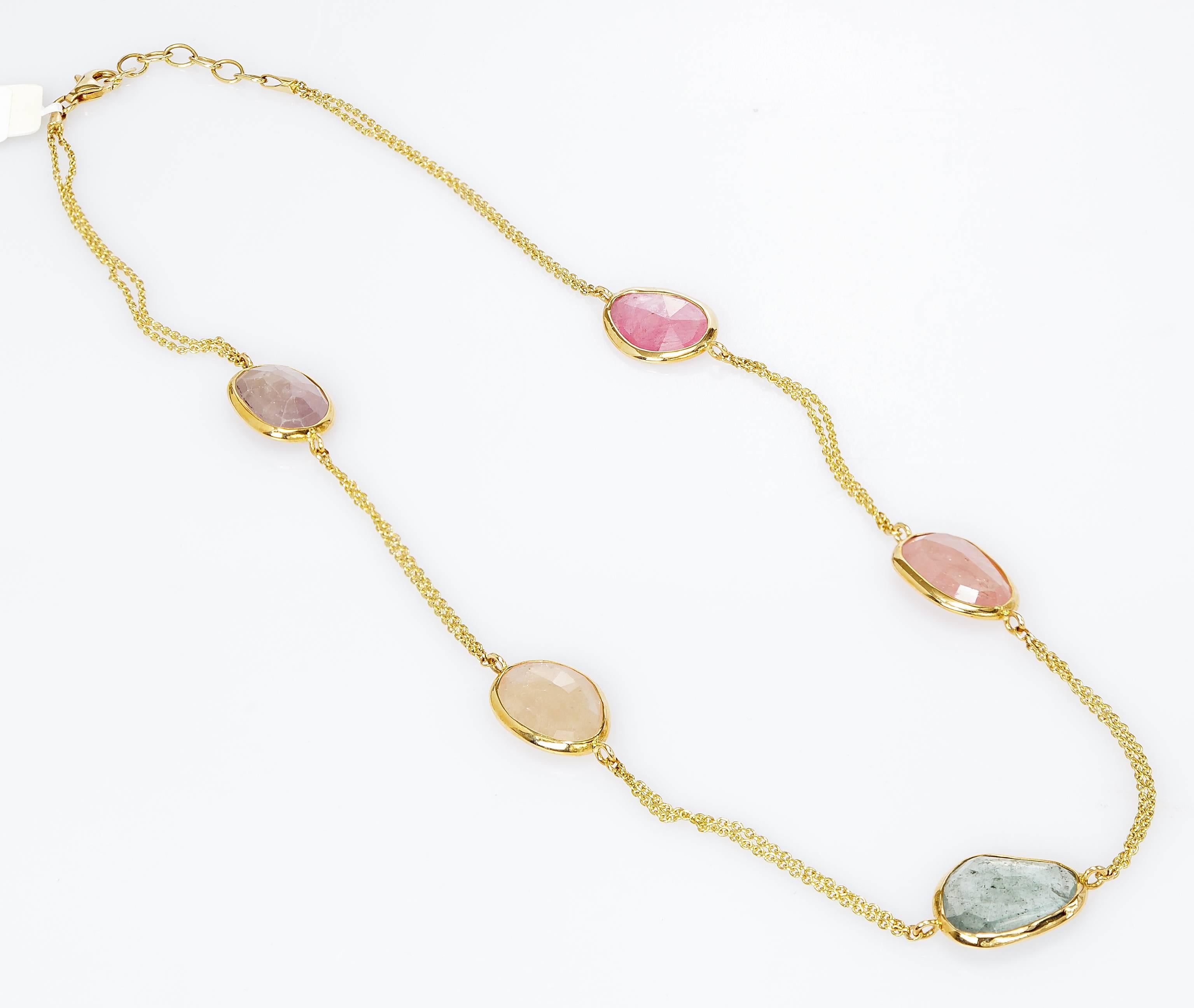 This Yvel necklace features five natural color rose cut sapphires linked by an 18k yellow gold chain.  The necklace measures 17 inches.