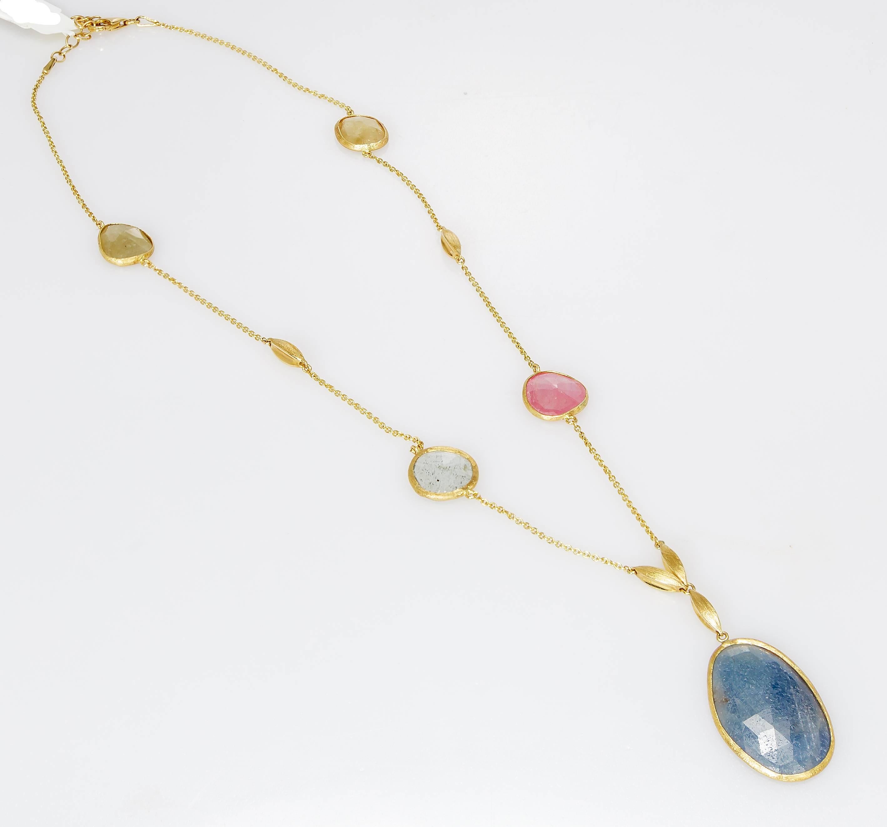 This Yvel drop necklace features five natural colored rose cut sapphires totaling 28.00 ct. on an 18 inch 18k yellow gold chain.
