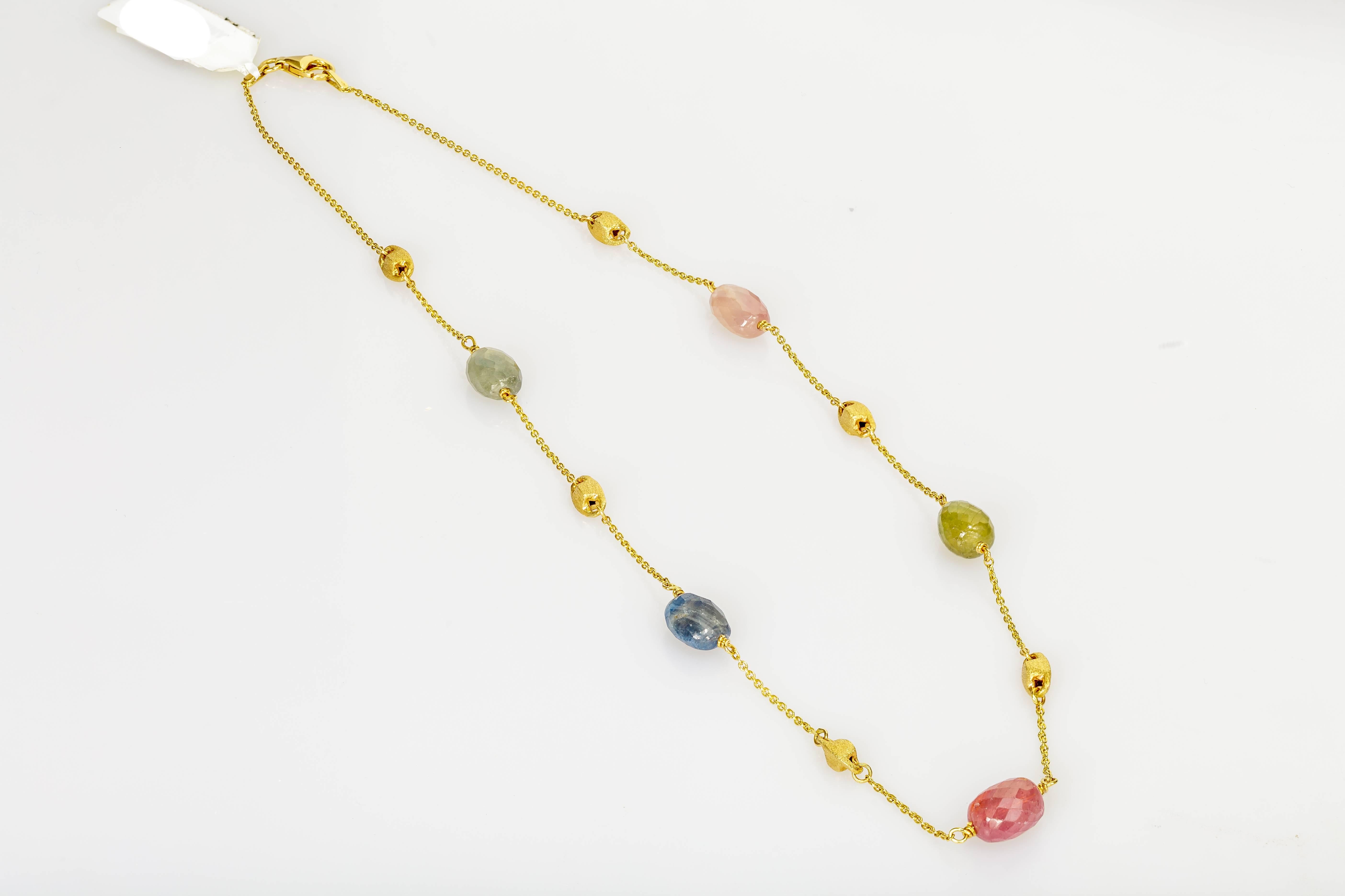 This Yvel necklace features five rose cut natural fancy colored sapphire beads on a 16 inch 18k yellow gold chain.