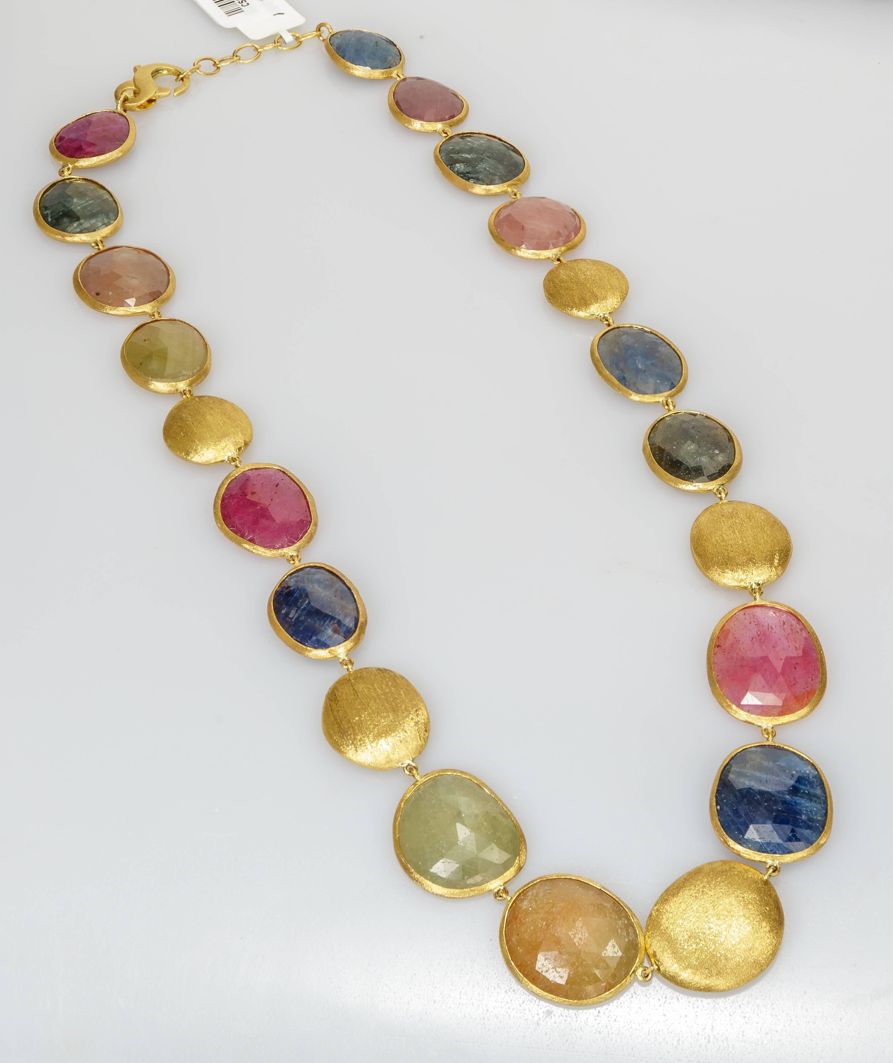 This Yvel necklace features 114.00 ct. of rose cut natural fancy colored sapphires as well as gold beads, linked by 18k yellow gold.  This necklace measures 18 inches long.