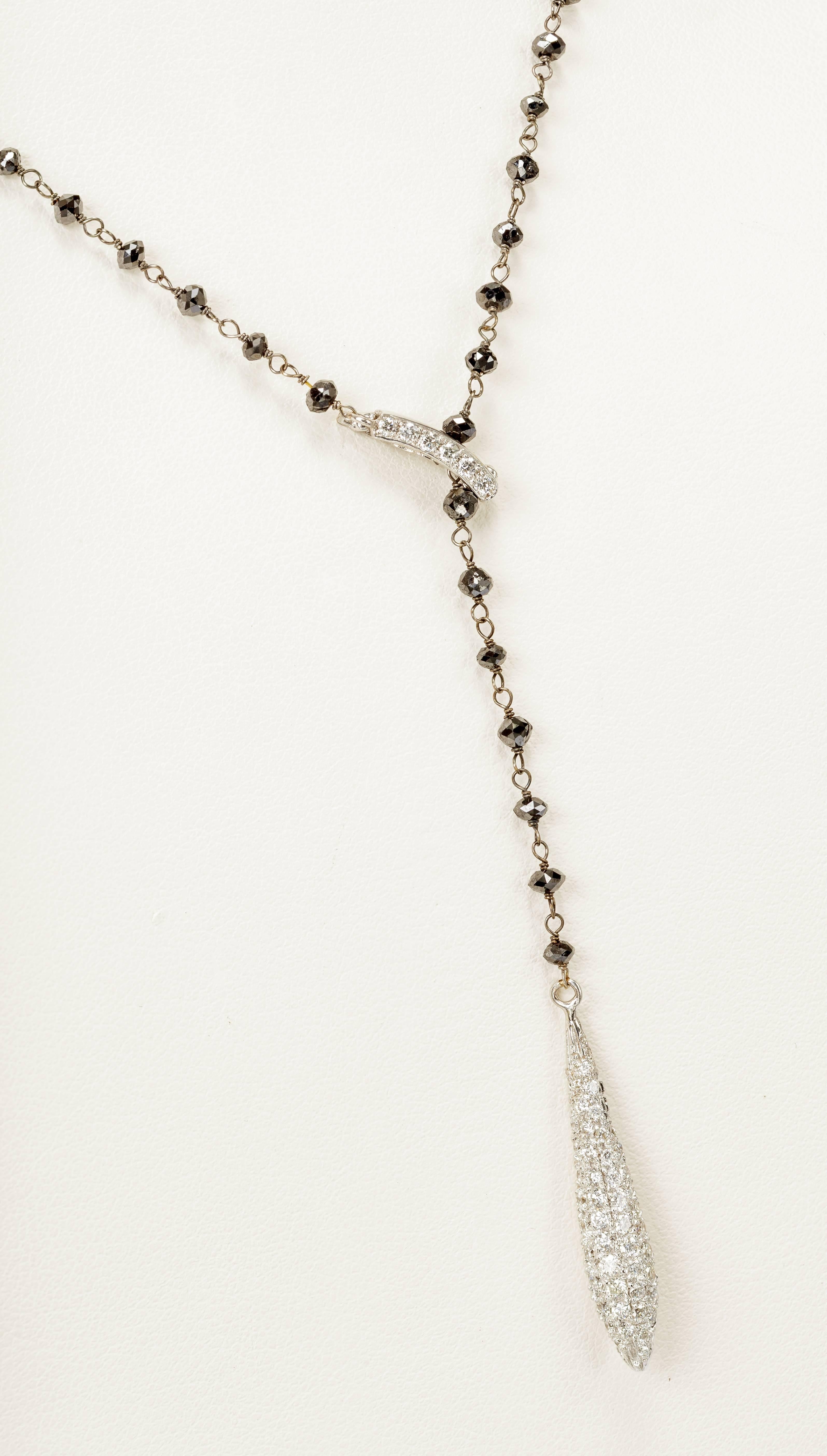 This Yvel lariat necklace features 1.70 ct. of colorless diamonds and 3.28 ct. of black diamonds on an 18k white gold adjustable lariat. We have the matching earrings listed as well. Please message us if you cannot find the listing. 