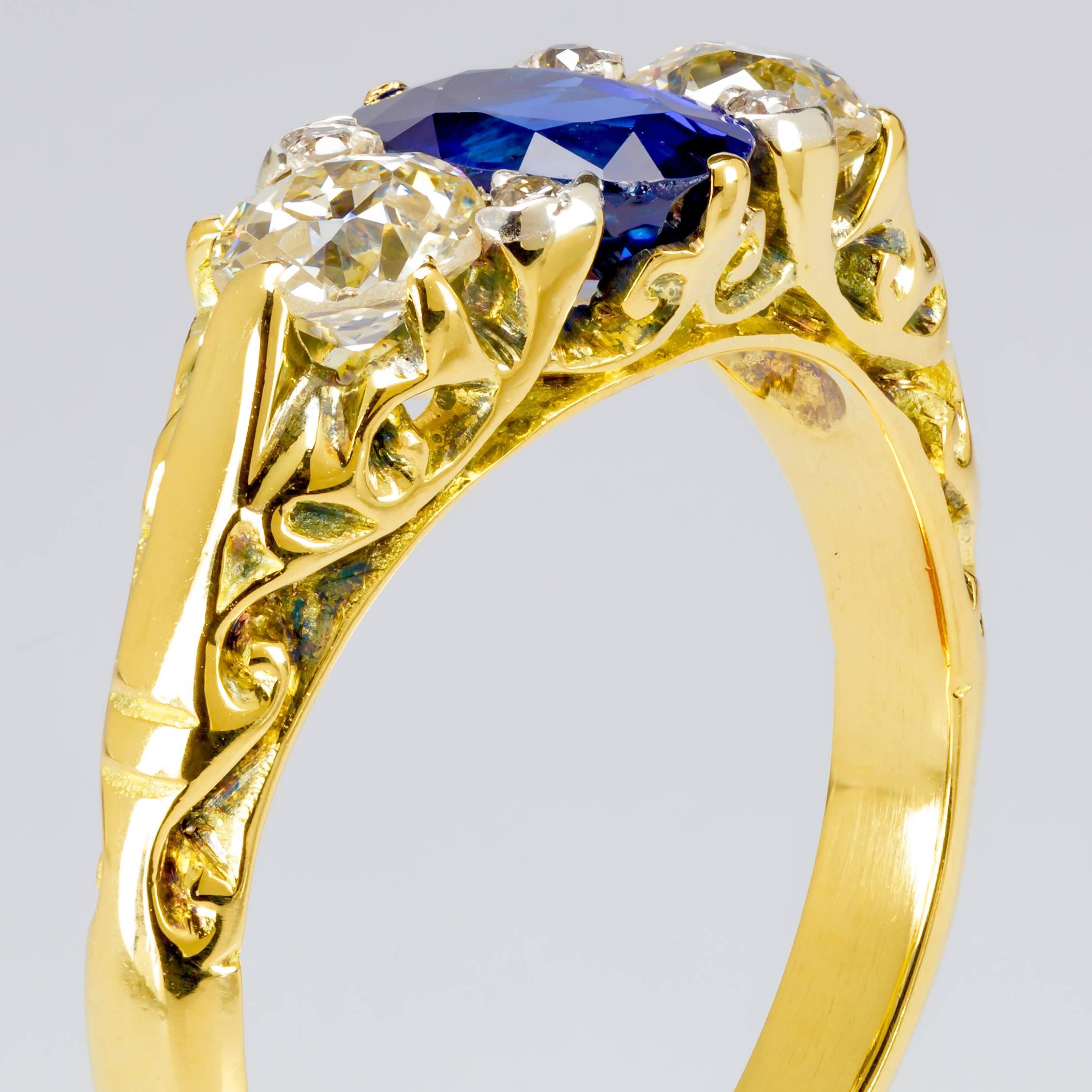 This one-of-a-kind 18k yellow gold ring features a 1.00 ct. oval sapphire measuring 7mmx5mm, 6 round brilliant diamonds totaling 0.60 ct., and intricate metalwork.  

The ring measures a size 5.5.