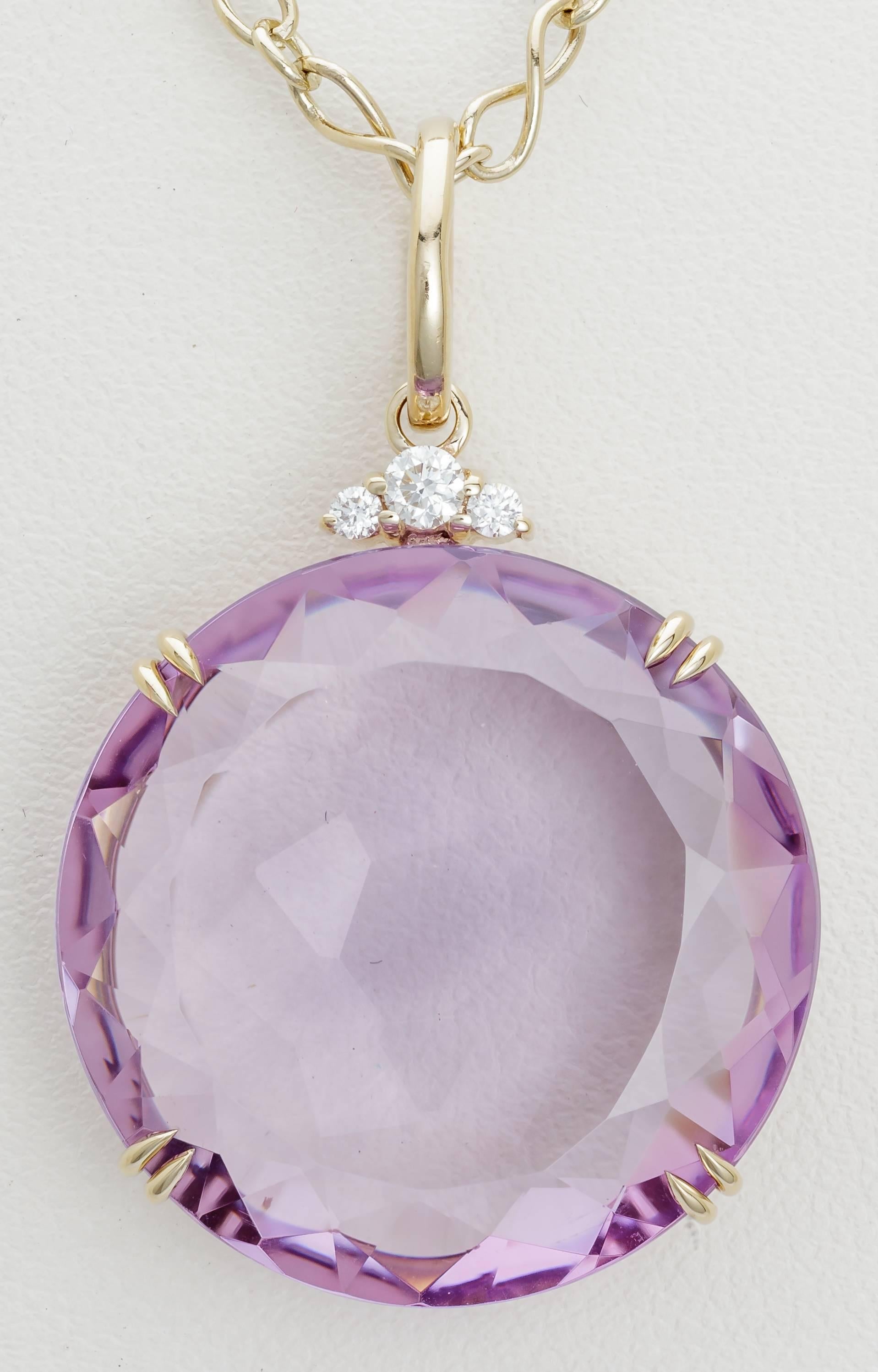 This new H. Stern necklace features a pendant from their Cobblestone collection on an 18k noble gold chain.  The pendant has a 27.00ct amethyst set in noble gold with diamonds totaling .09ct.  Noble gold, H. Stern's exclusive gold alloy, is between