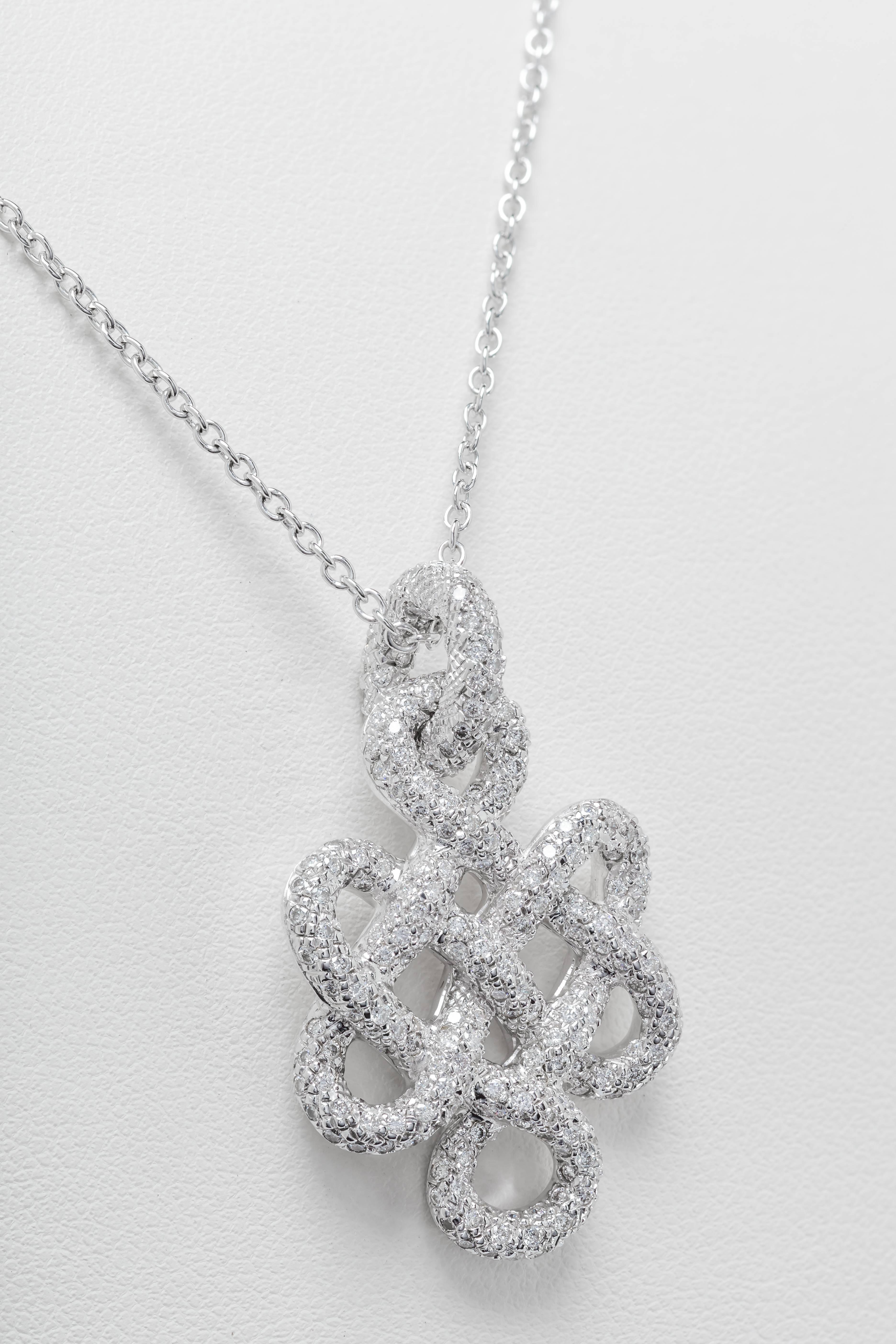 This new H. Stern Diane von Furstenberg necklace features a pendant with diamonds totaling 1.57ct set in 18k white gold.  The pendant is set on an 18" 18k white gold chain.  The pendant measures 35mm tall and 22mm wide.