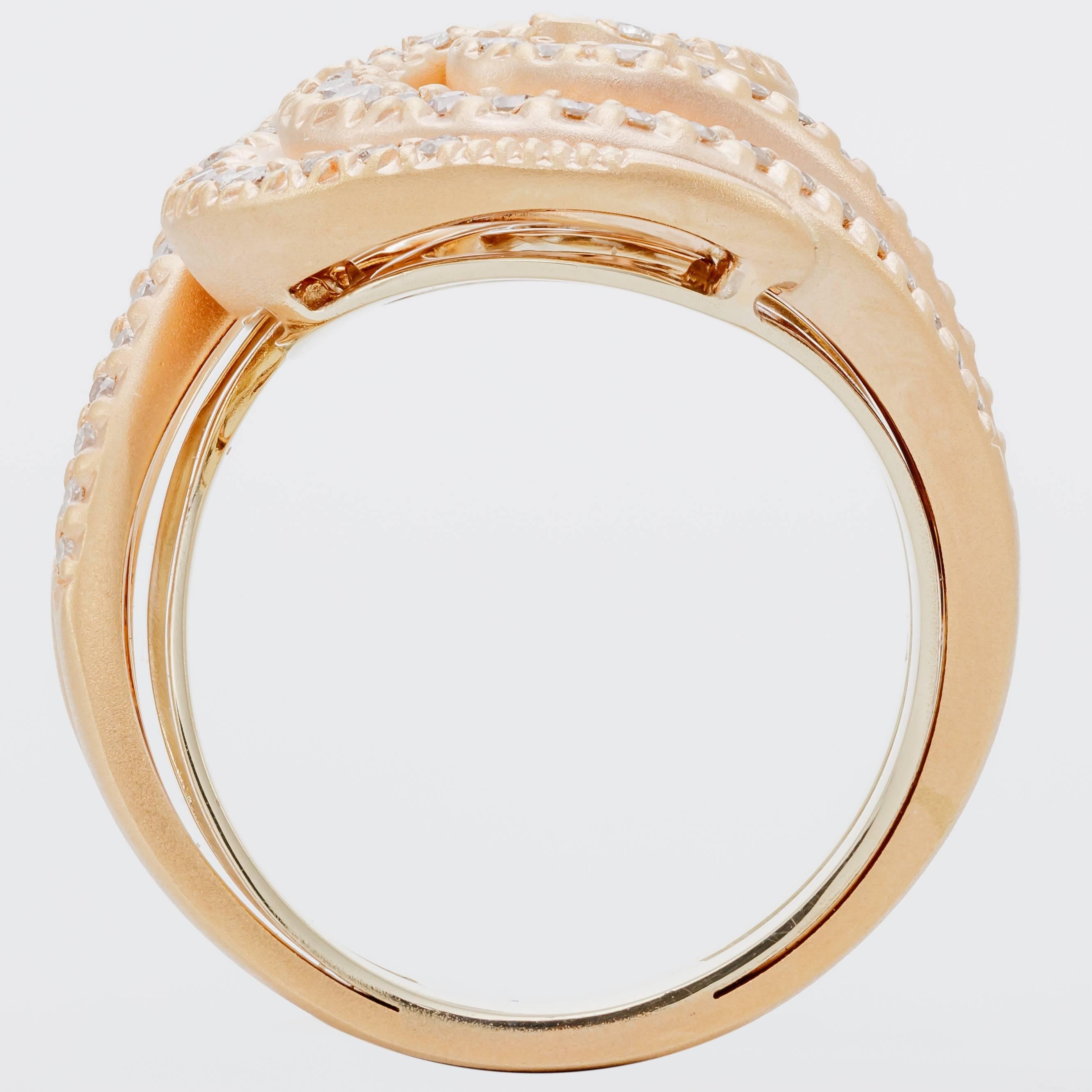 This new H. Stern Iris ring features diamonds totaling 0.76 ct. set in 18K rose gold and noble gold.  Noble gold, H. Stern's signature alloy, has the warmth of yellow gold and elegance of white gold.  The ring is a size 7.  It measures 1 inch tall,