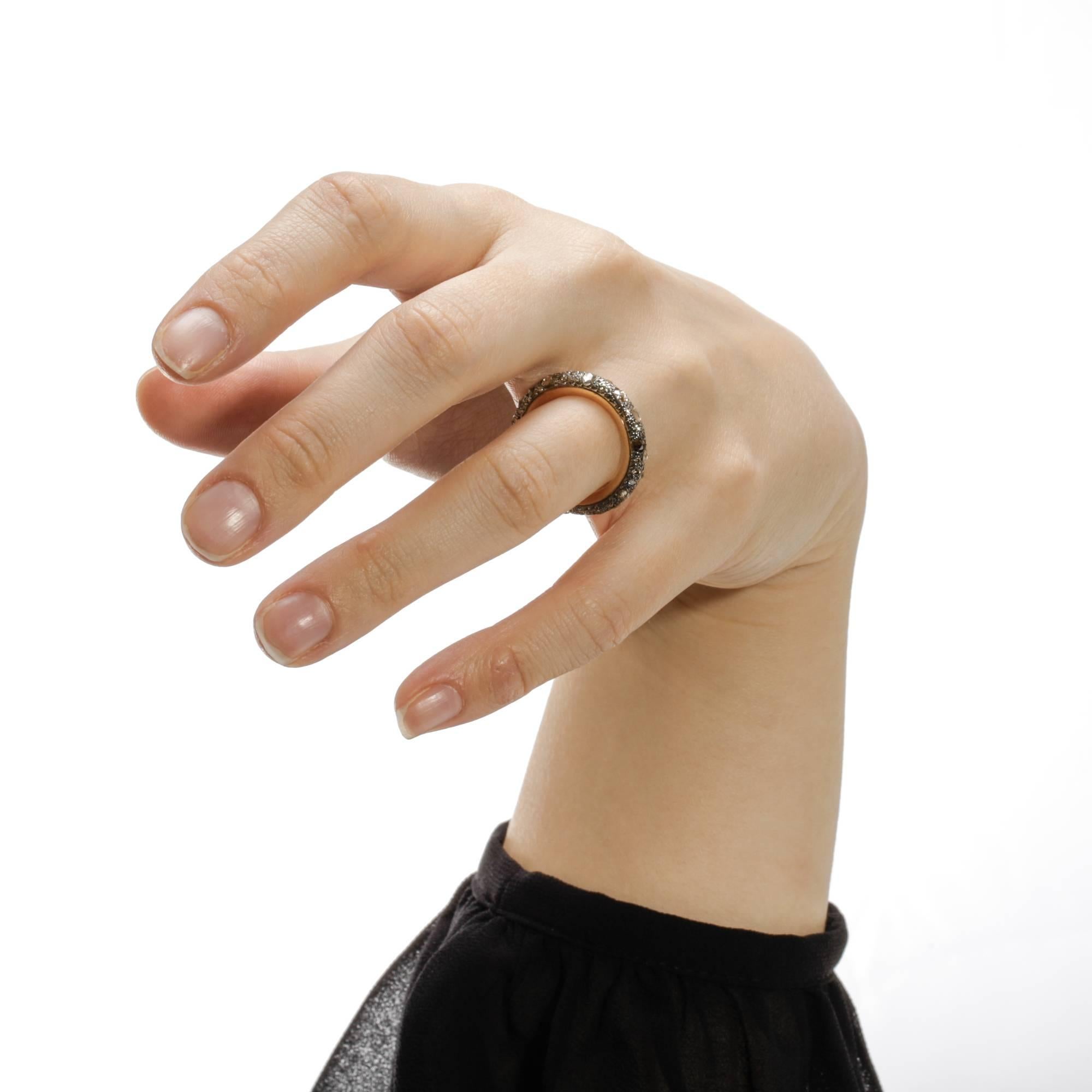 Pomellato's Sabbia collection is inspired by the natural beauty of sand in the sun. This band ring has a total of 1.91 ct. of different sized cognac diamonds in varying shades of brown, irregularly set to reflect the unpredictability of nature.