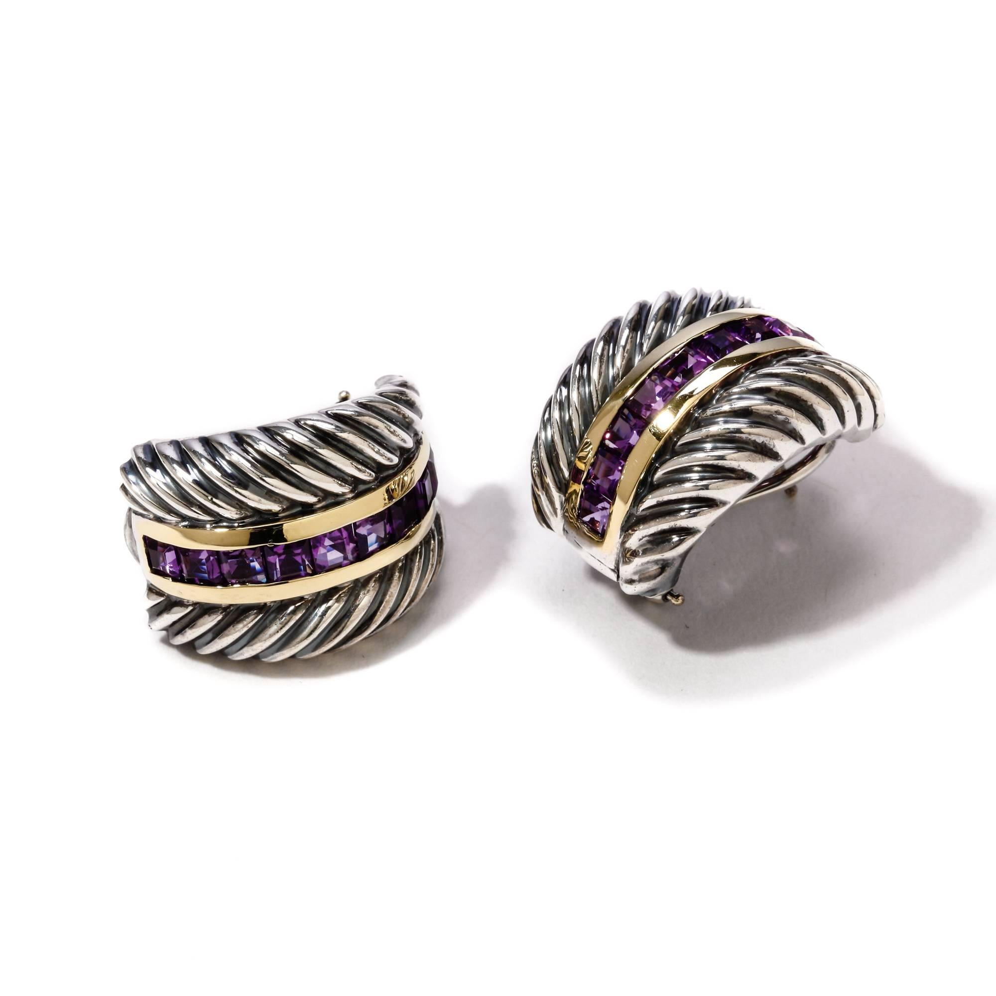 These David Yurman amethyst, sterling silver and 14 karat yellow gold cable earrings are in good condition. The yellow gold is slightly worn at the top and bottom of the earrings, but this is not noticeable when the earrings are worn. Each earring