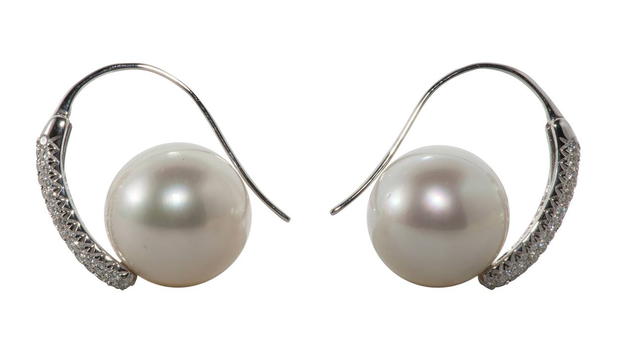 Beautiful South Sea Pearl (14mm) and diamond (.76ct) earrings set in 18K white gold.