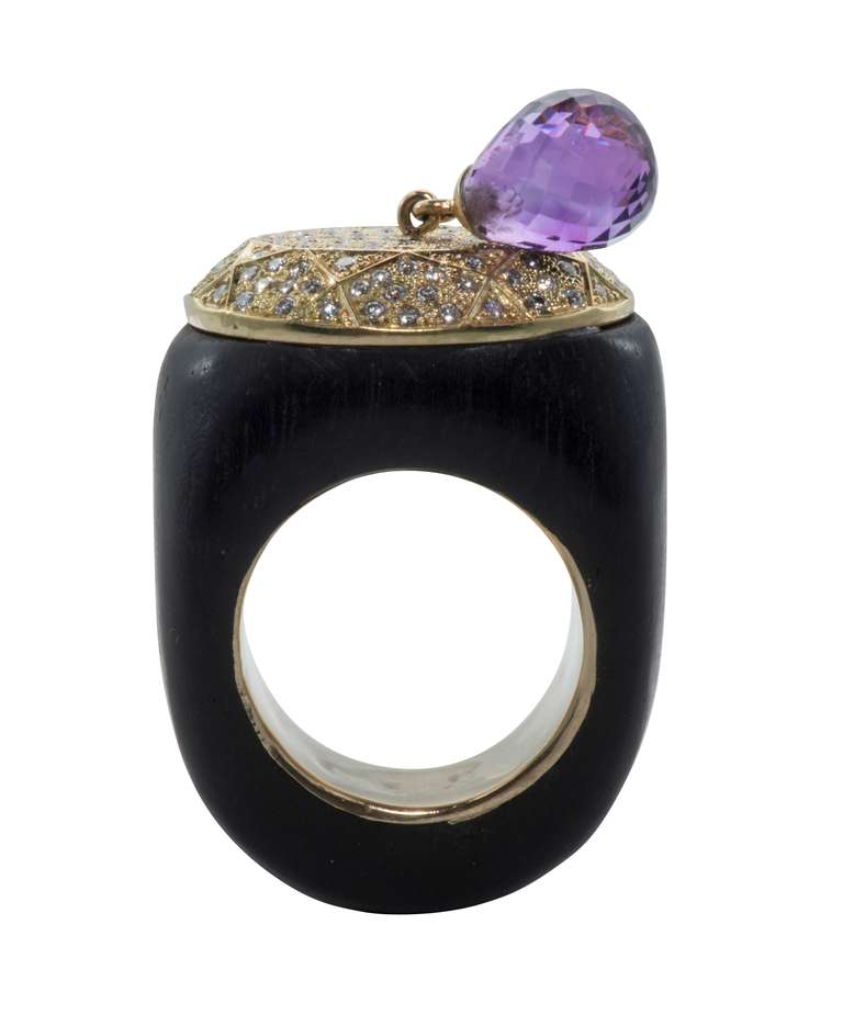 Ring of Ebony from 1930.  Oval 18kt gold top set with diamonds and a faceted natural amethyst drop.  Diamonds = 1ct total weight,G color VVS clarity.  Inside of ring lined with 14kt gold.