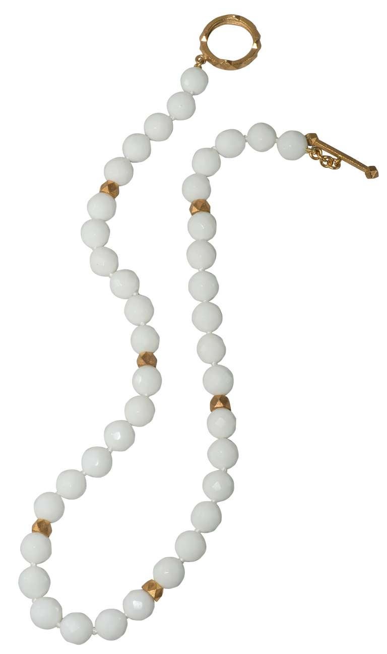 Faceted White Agate Beads with Yellow Gold Pyramid spacers and matching toggle clasp.