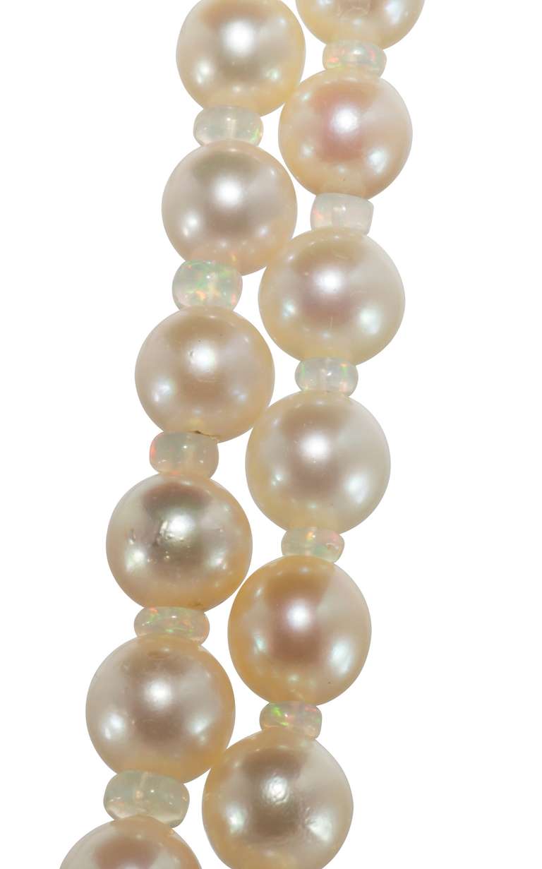 Elegant double strand of Pearls with Opal beads set between each pearl with a beautiful Opal and Diamond and Pearl clasp.