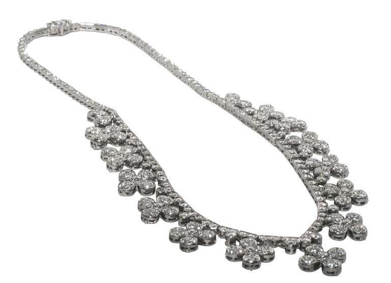 White gold (marked 750) and diamond necklace containing 129 diamonds.