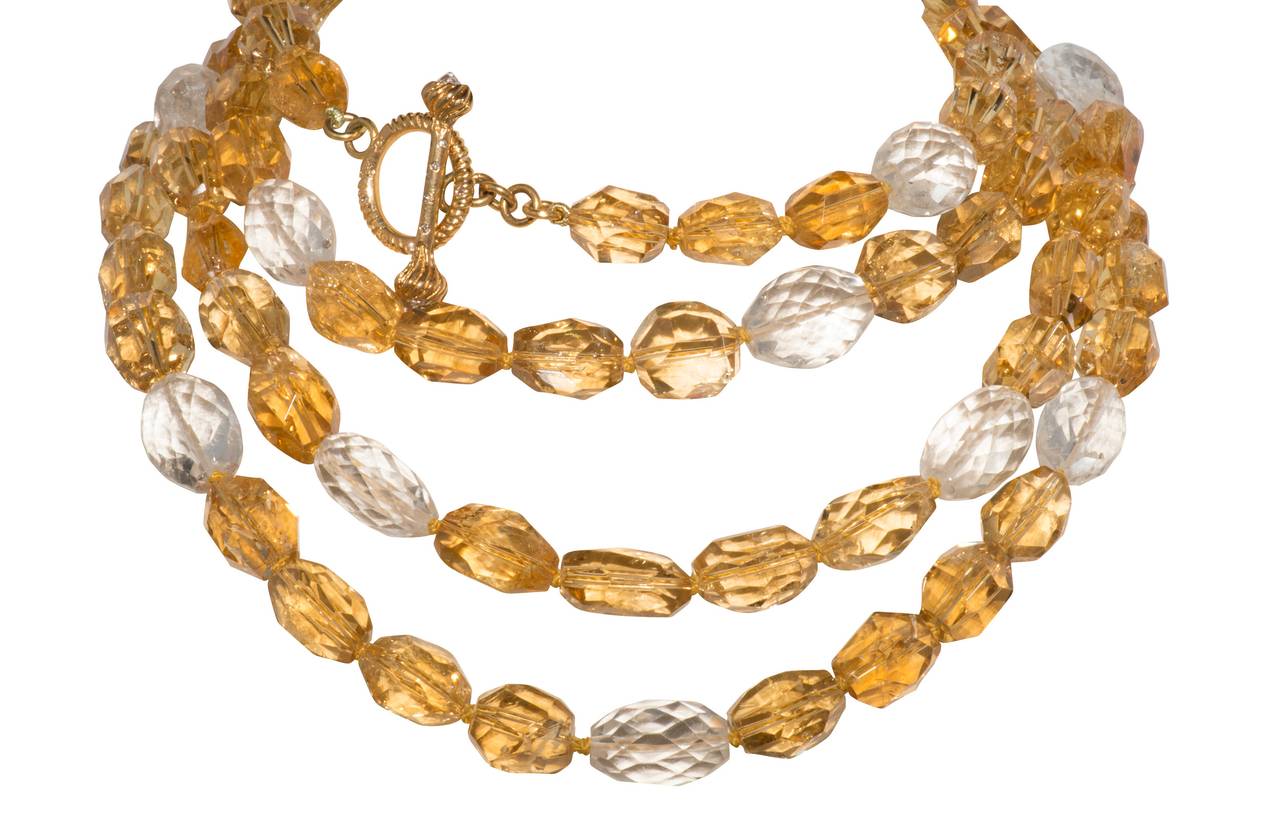 Faceted citrine and rock crystal bead necklace with 18k and diamond toggle clasp.  61 inches long.