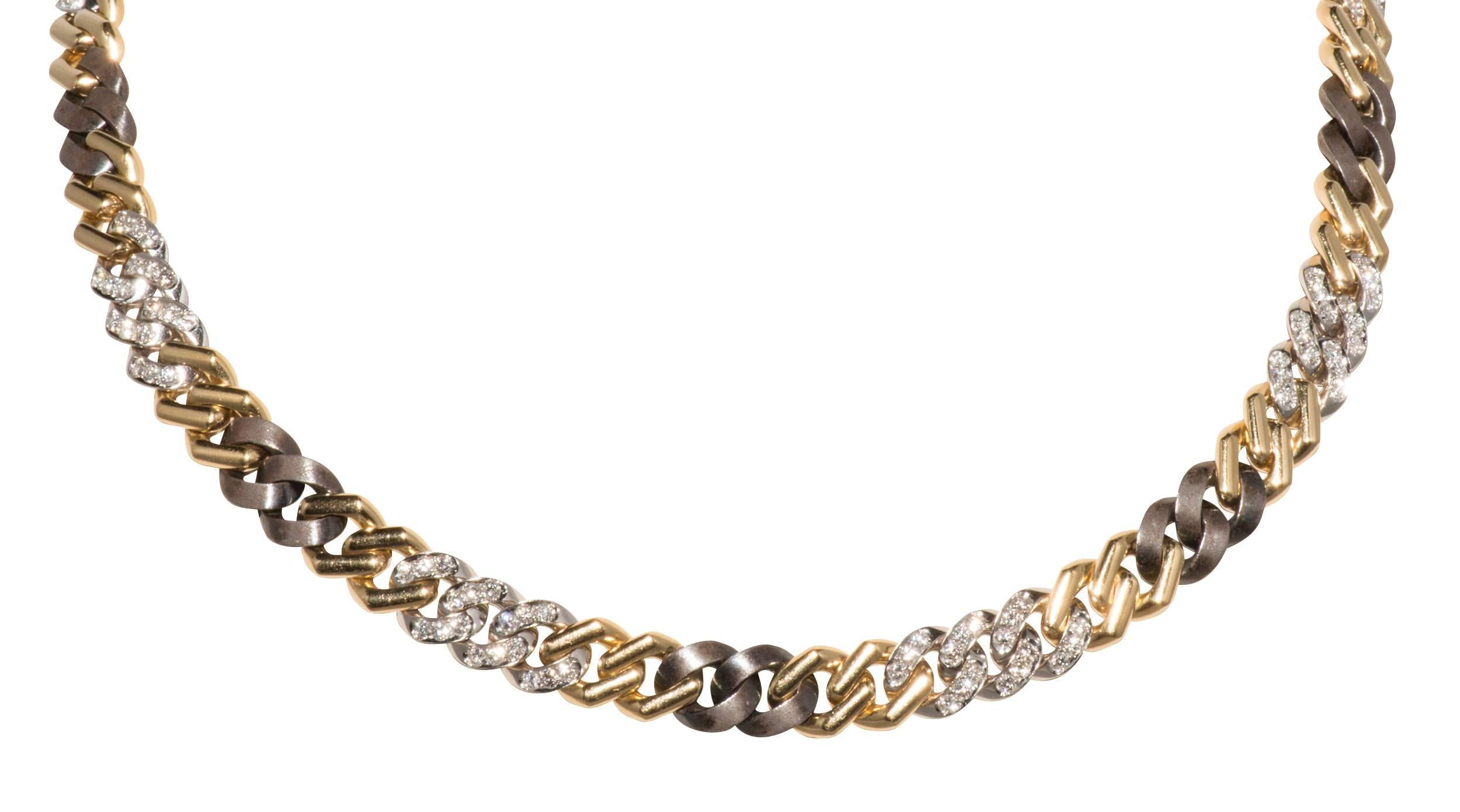 This is a beautiful curb link necklace made of yellow gold, diamonds and patinated steel.  It is 16
