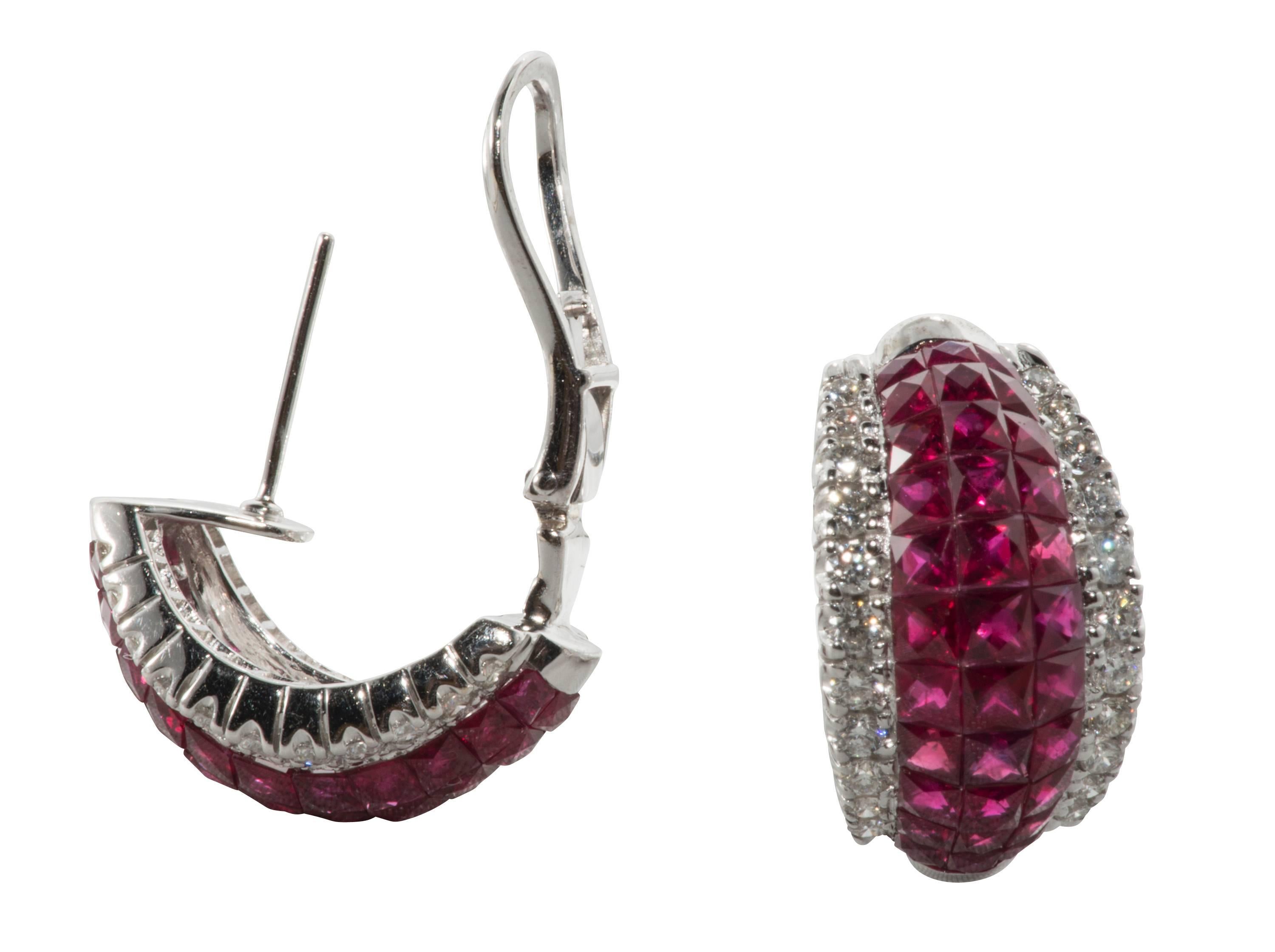 These are beautiful Burmese ruby and diamond earrings invisibly set in 18k white gold.