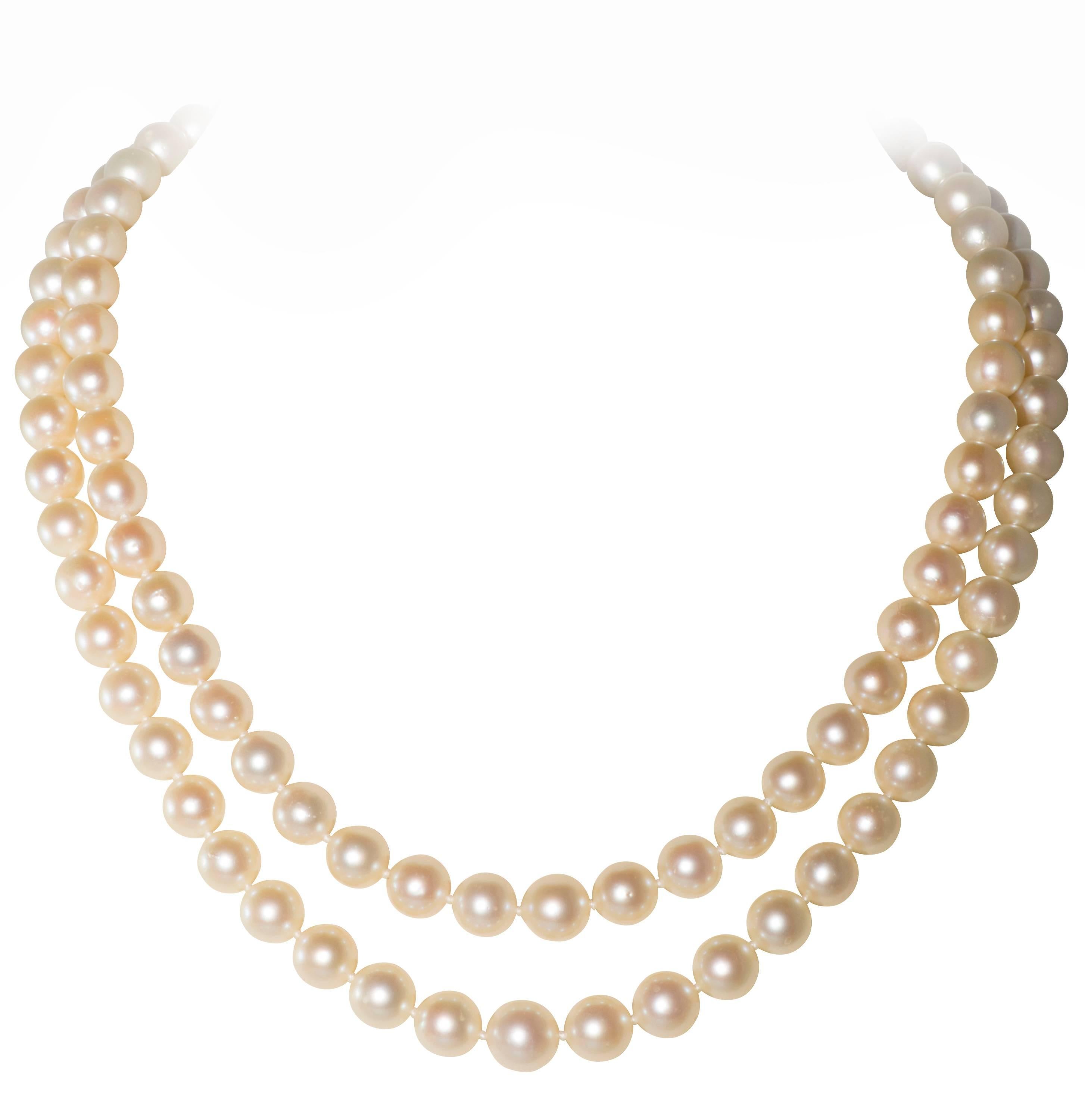 These are a double strand of graduated  Akoya pearls. The size of the pearls range from 6.6mm to 9.6mm.  The clasp consist of diamonds with a light fancy pink marquis center stone. The center stone weighs approximately 1/3 ct.