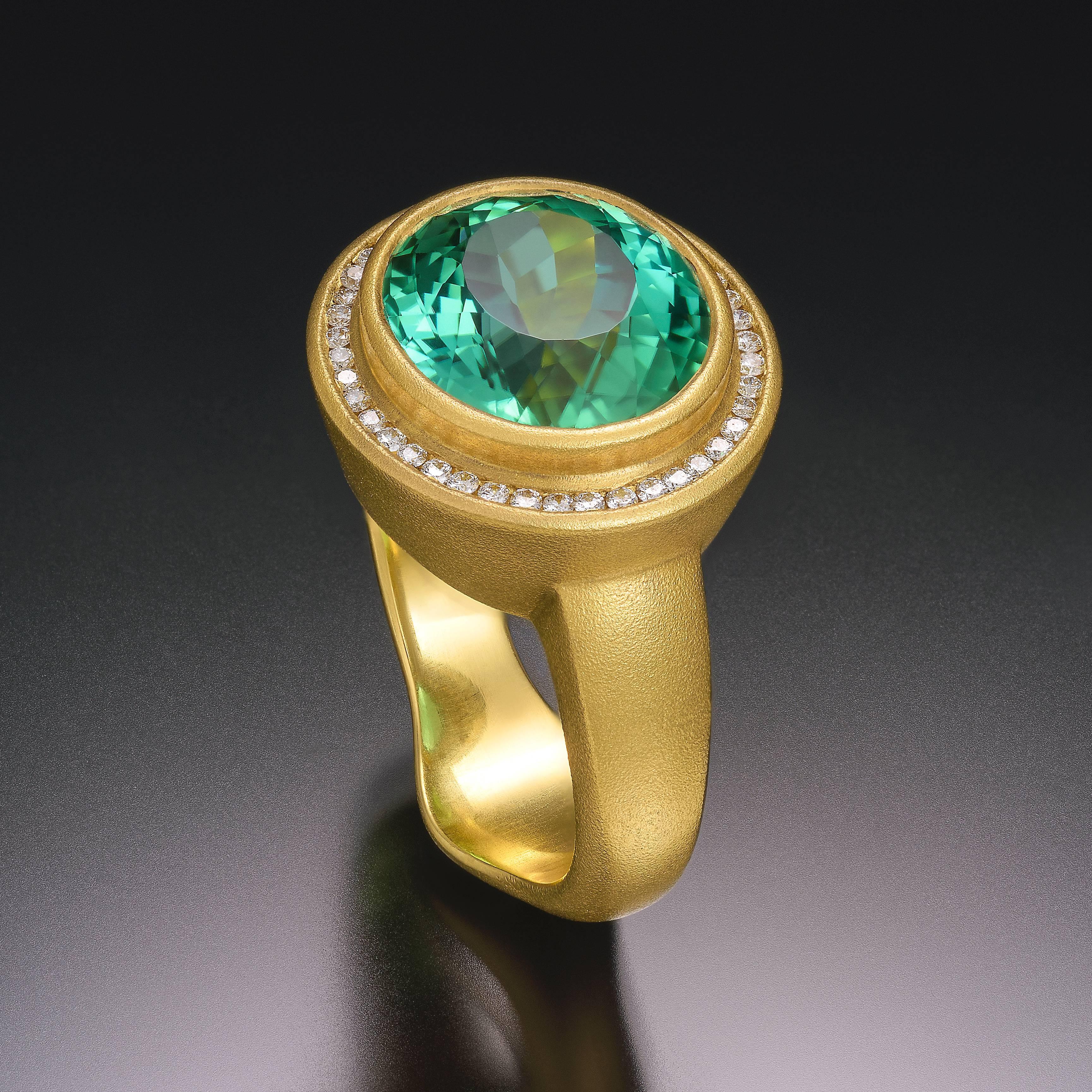 Handcrafted 22kt Gold Ring set with very rare 6.65 Green Mozambique Tourmaline and 42 Fvs white Diamonds. Brilliant sparkle and personality.

* Each piece is designed and crafted entirely by hand in the traditional way, using age old techniques