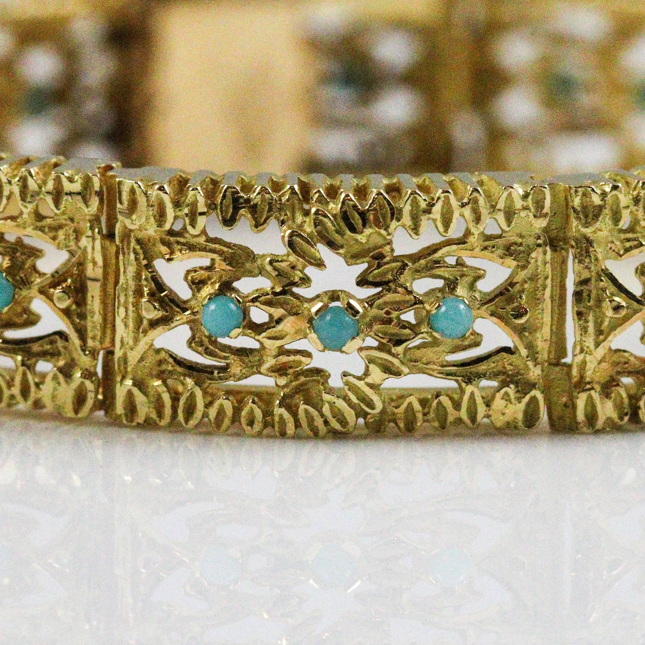 This beautiful 18k yellow gold bracelet features intricate filigree designed links, each one containing 3 small round Persian turquoise. The bracelet measure 11.8mm wide and 7.5 inches long. Each link is approximately 0.75 inches, so it could be
