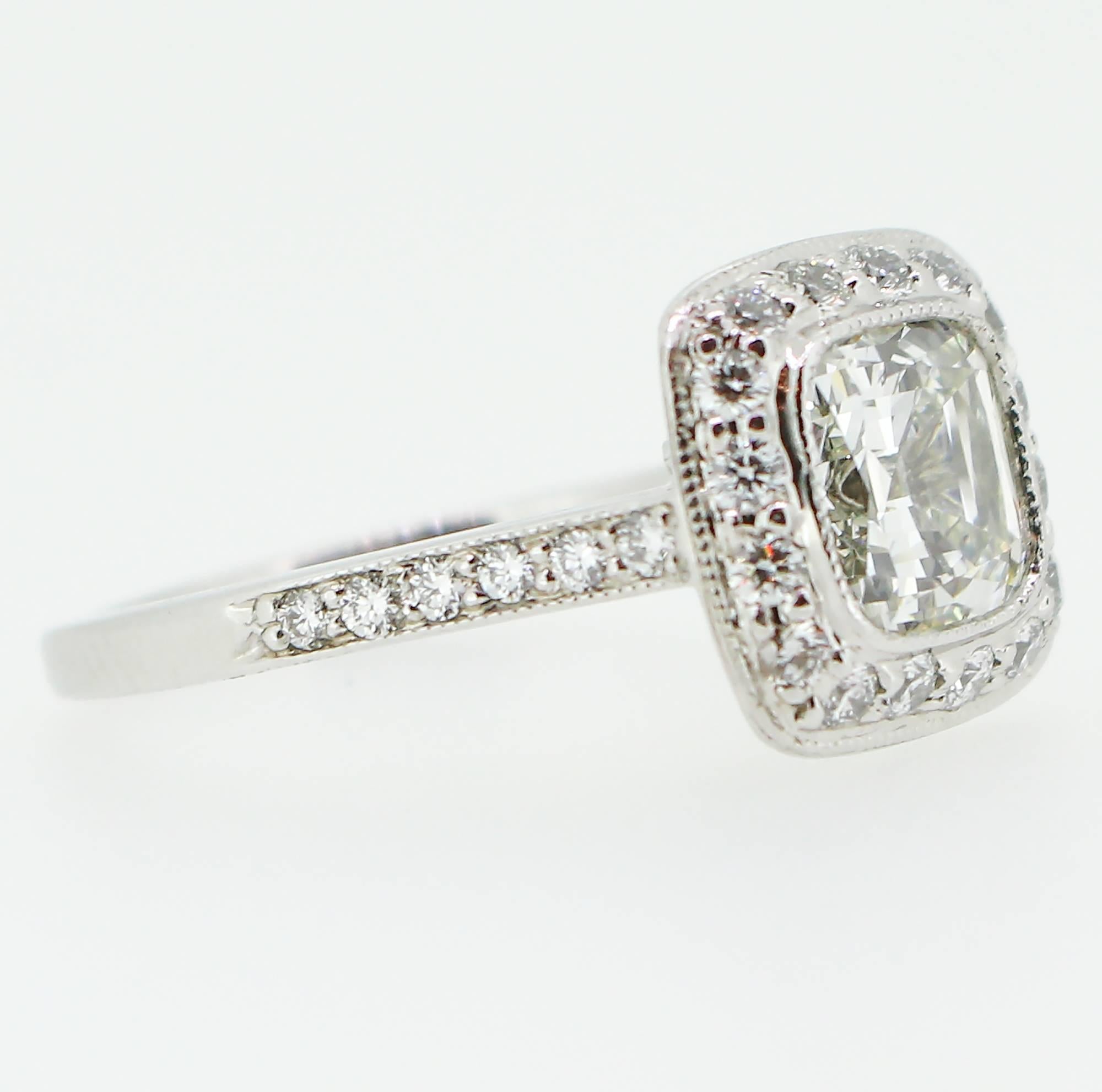 The center stone in this ring is a 1.62ct Legacy cushion cut diamond measuring 6.89 x 6.80 x 4.41mm and grading as an 