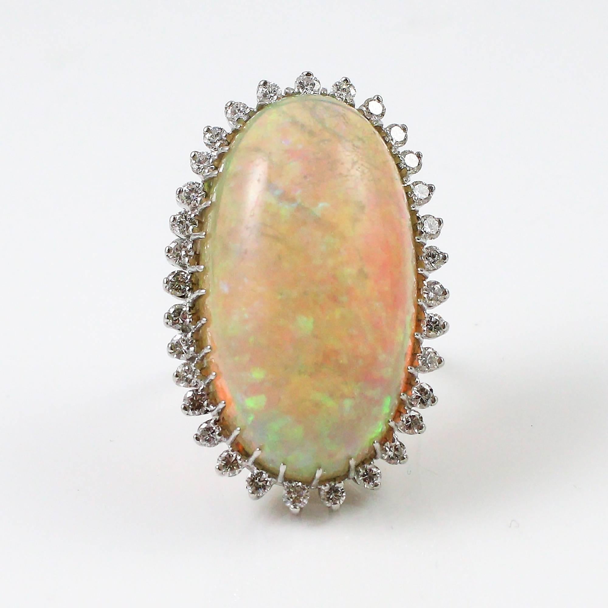1960s-70s Modernist 47.05 Carat Cabochon Opal Ring with Diamond Halo 1