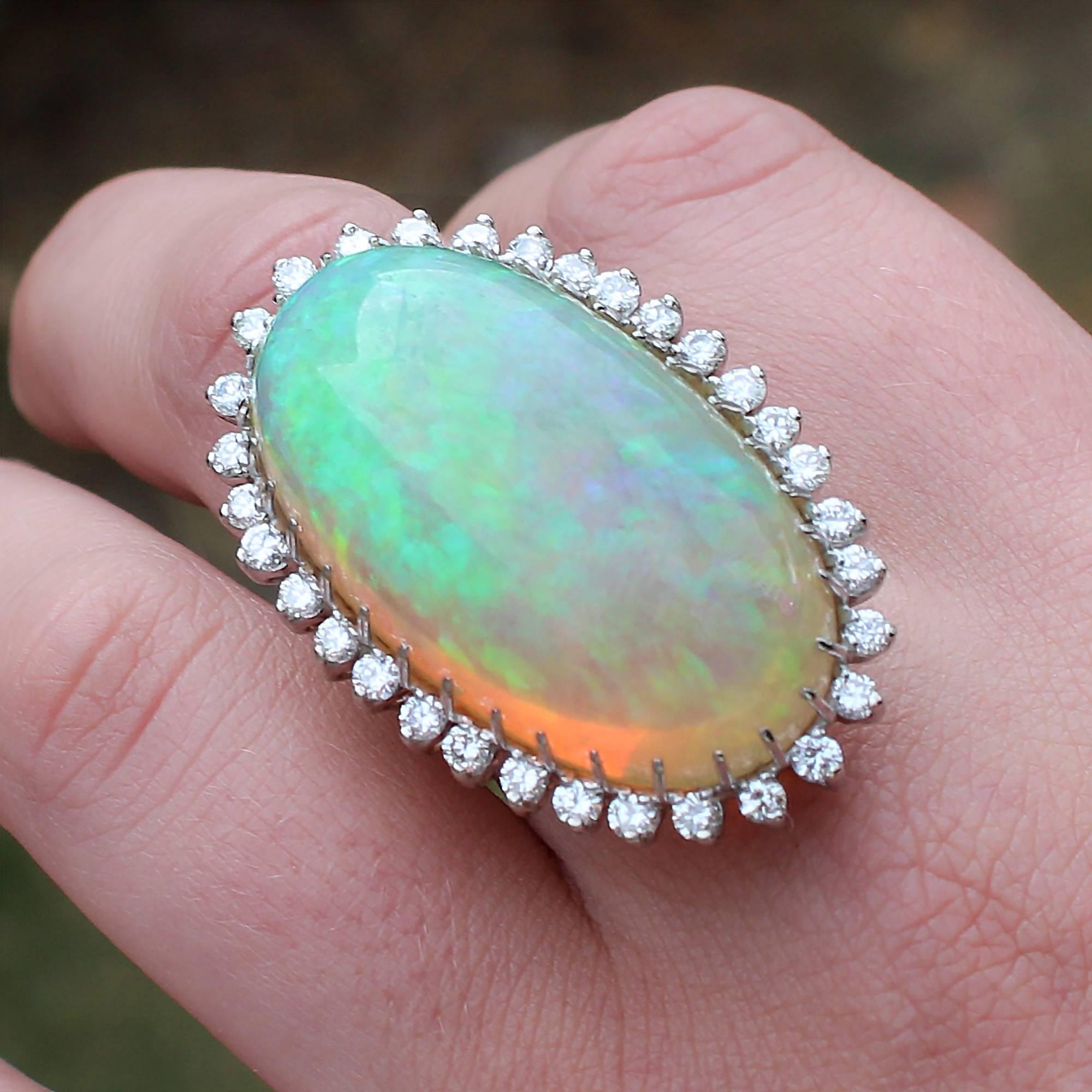 Women's 1960s-70s Modernist 47.05 Carat Cabochon Opal Ring with Diamond Halo