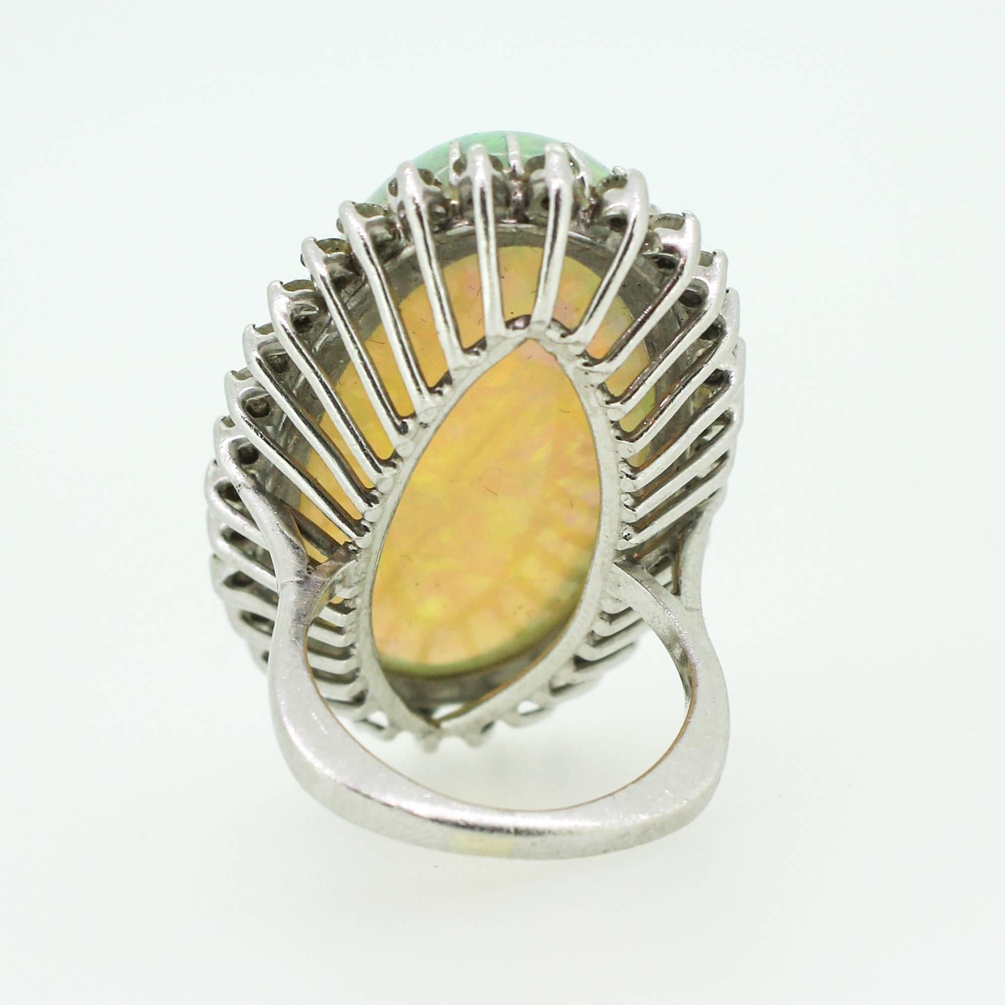 1960s-70s Modernist 47.05 Carat Cabochon Opal Ring with Diamond Halo 3