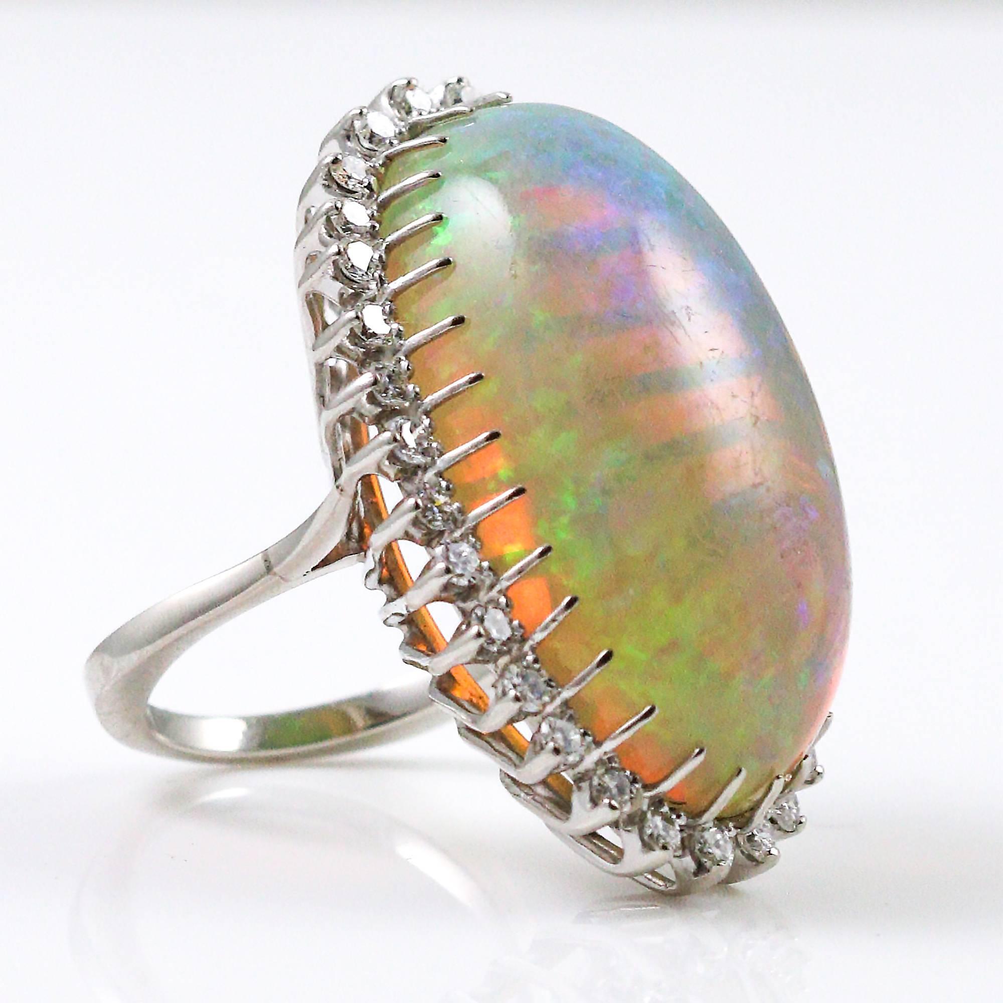1960s-70s Modernist 47.05 Carat Cabochon Opal Ring with Diamond Halo 4