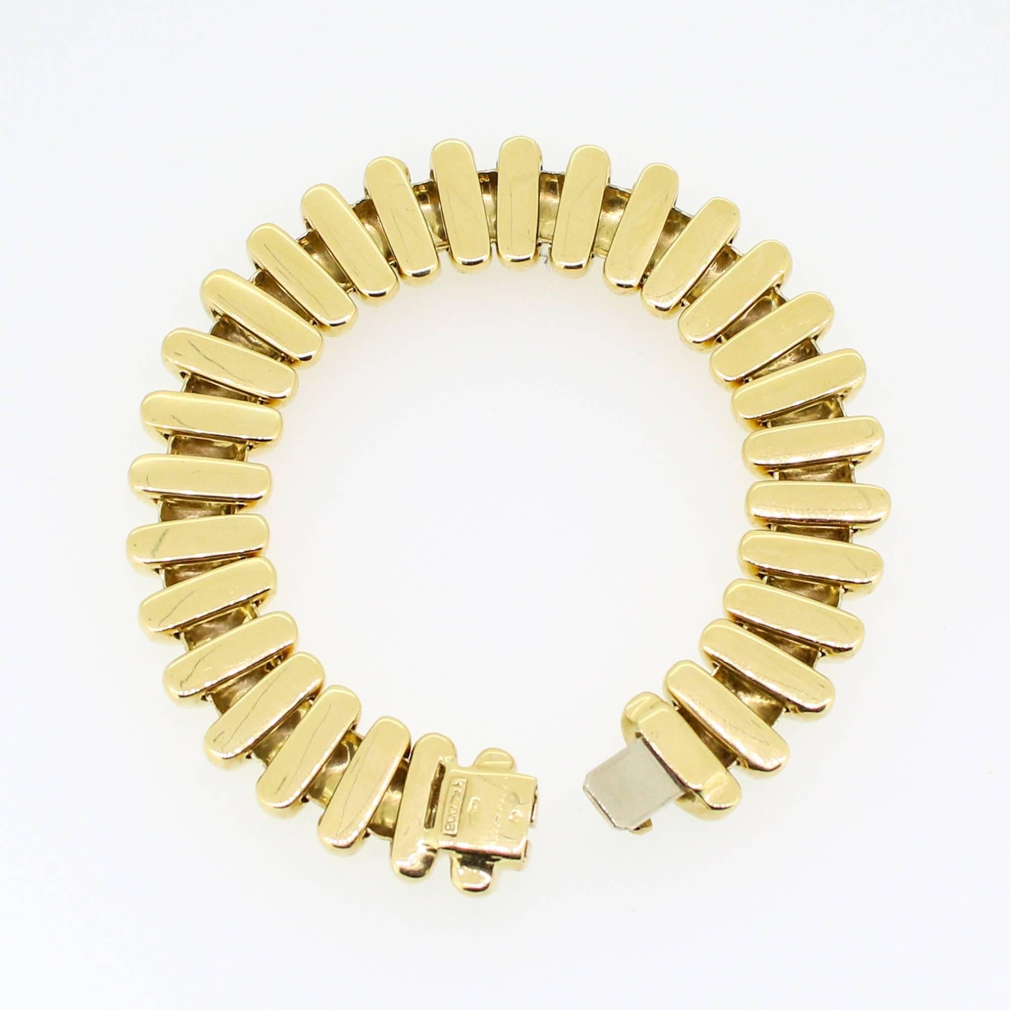 This fabulous bracelet has a very unique design that attracts attention without the need for stones. It is 18k yellow gold, 7.75 inches and weighs 76.2 grams. It is signed 
