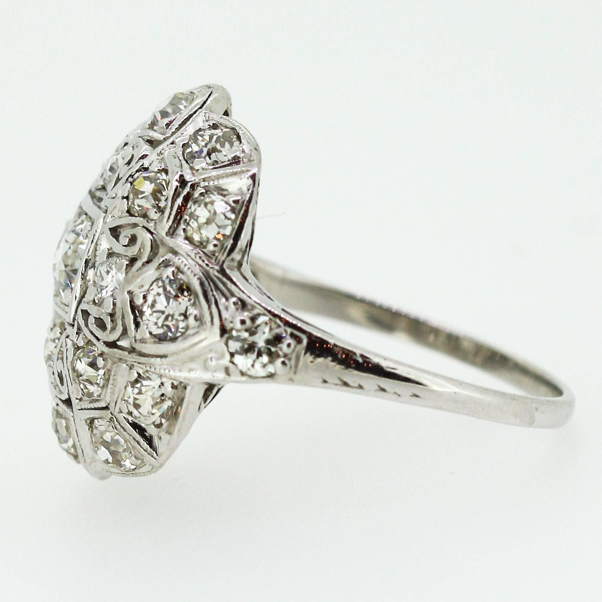 This gorgeous cocktail ring centers a European cut diamond which weighs approximately 0.30ctw and is accented by 23 other European cut diamonds weighing an approximate total of 2.20ctw. The stones range H-I in color and VS2-SI1 in clarity. The