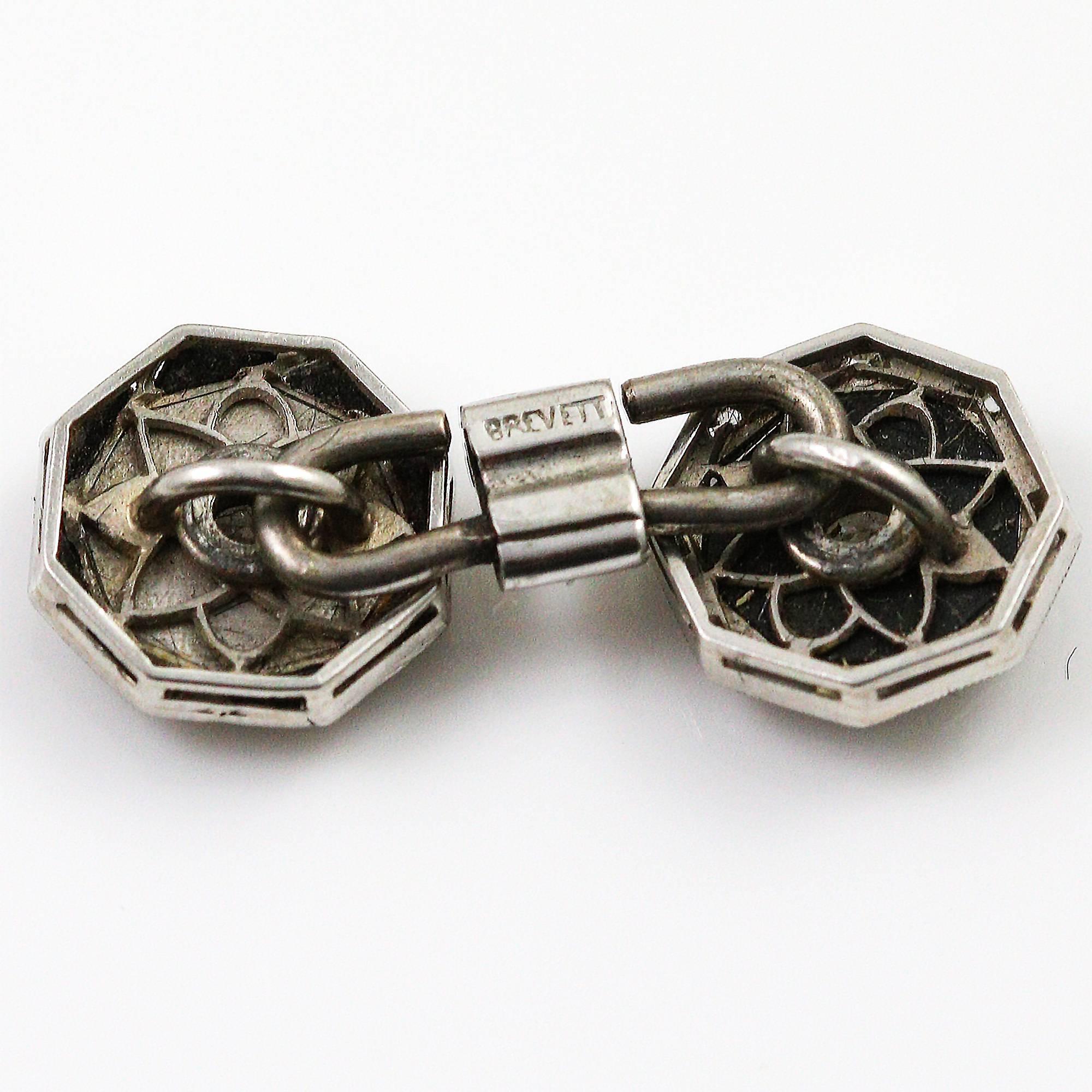 These striking reversible cufflinks offer 2 great looks. They are made in platinum and signed 