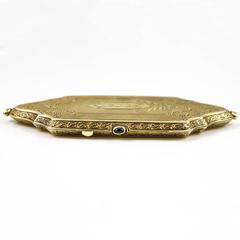 Exquisite Gold Engraved Compact With Sapphire Accents