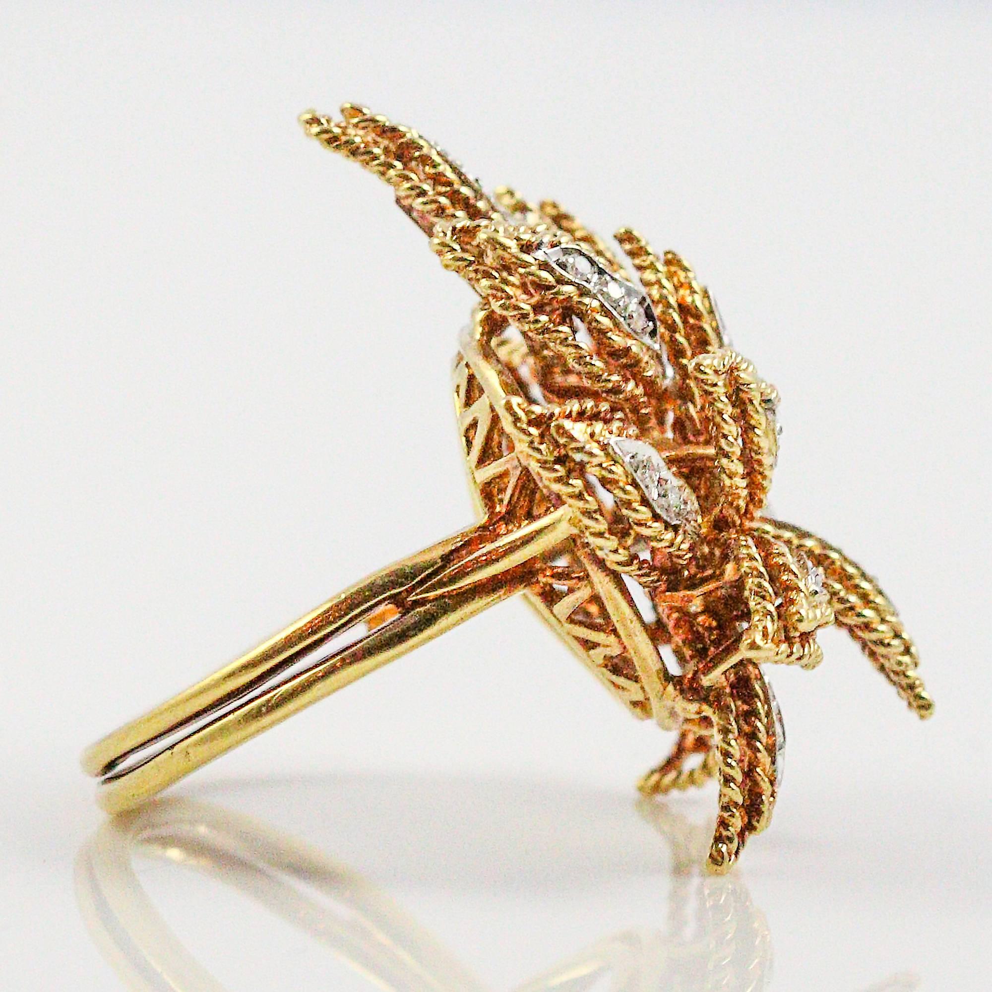 This eye-catching, Modernist ring was most likely made in the 1970s, by the Greek designer, Vourakis. It is made in 18k yellow gold with 27 single cut diamonds that are estimated to weigh a total of 0.20ctw and grade as "G-H" in color and