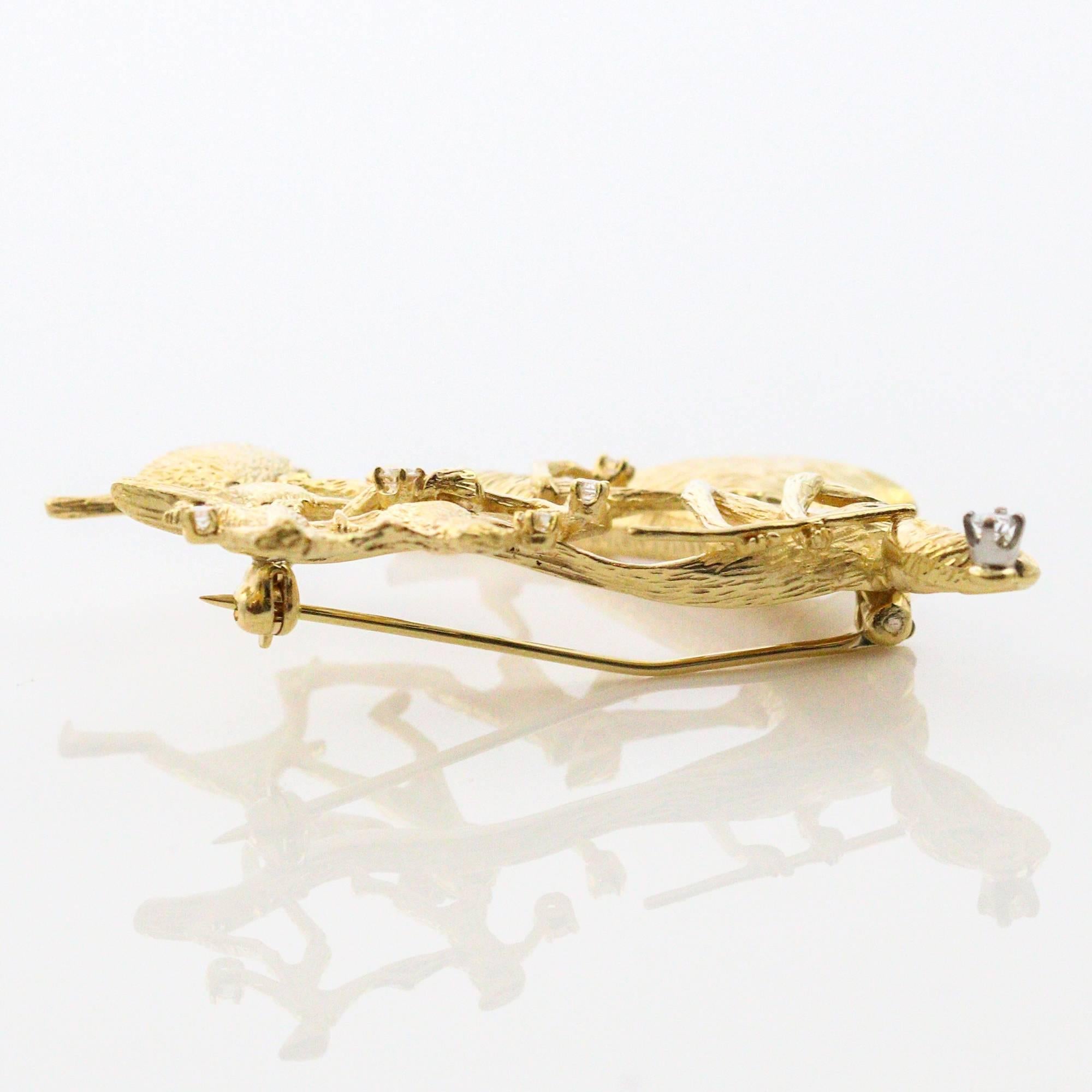 This whimsical Modernist brooch, made in 18k yellow gold tells the Germanic story of the Pied Piper. The children are chasing the flute player eagerly, each one of them holding a small round brilliant cut diamond. The total weight of all 6 round