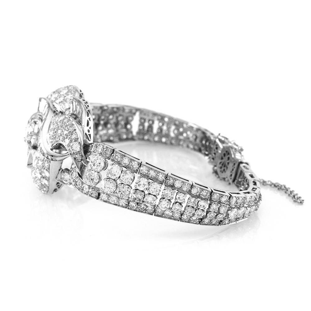 Vintage mid-century diamond bracelet in high polished platinum. There is one round brilliant cut center diamond (1.00ct) with color I and clarity of I1. There are one hundred sixty round brilliant cut diamonds (7.68ctw), ninety-four round single cut