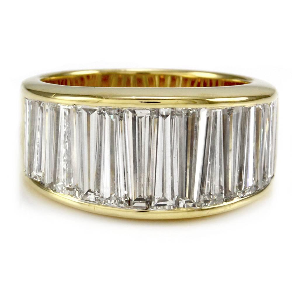 Christopher Designs diamond anniversary band/ ring in high polished 18K yellow gold. There are fifteen tapered baguette cut diamonds (3.66ctw) with a color of E-F and a clarity of VVS1. The diamonds are illusion set. The overall size of this ring is