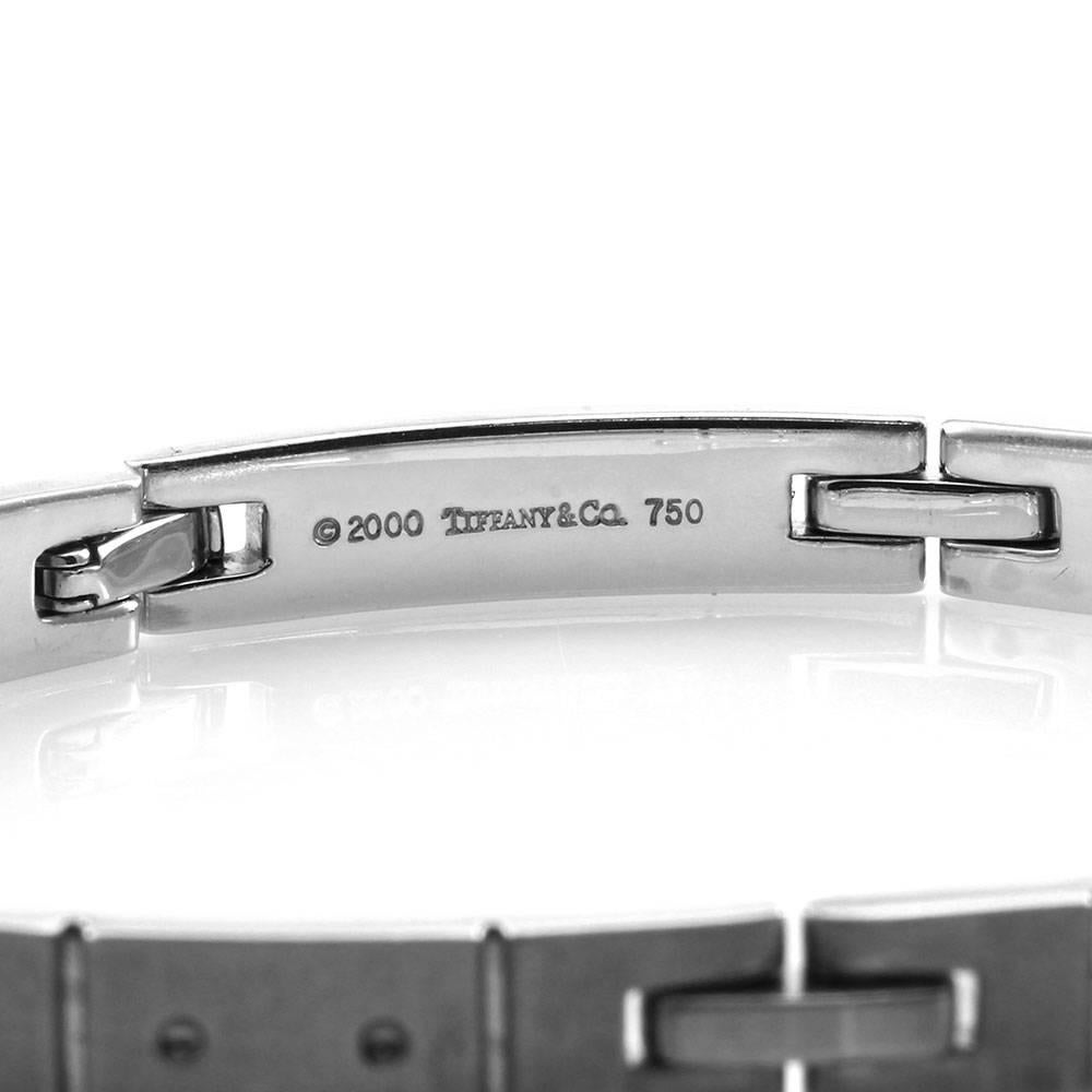 Signed designer Tiffany & Co. Streamerica collection men’s bracelet in satin finished 18K white gold. The bracelet is 6.7mm wide, with an 8 inch end to end length. The overall weight for this item is 48.4g/ 31.1dwt.

Size: 8