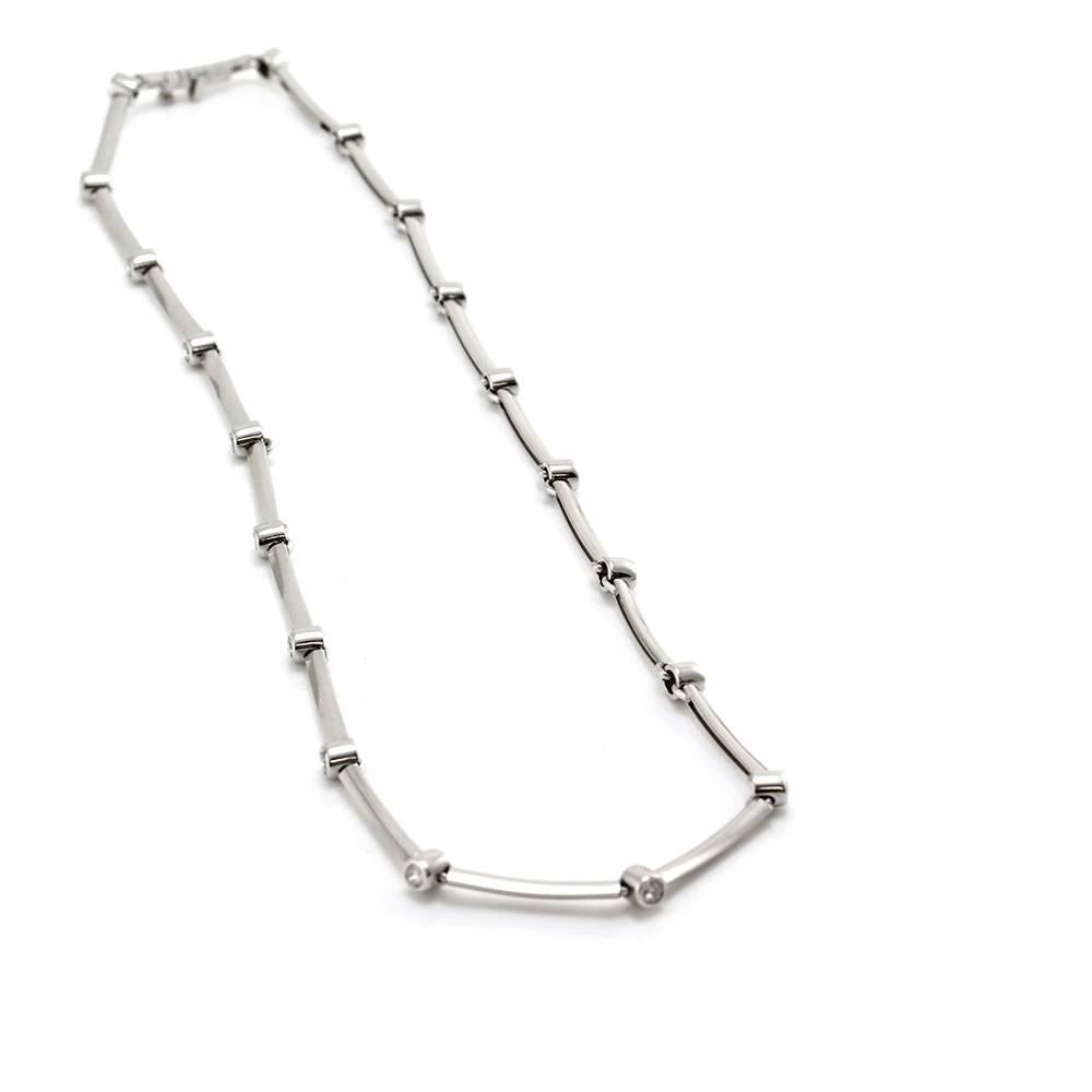 Tiffany & Co. diamond bar necklace in high polished platinum. There are nineteen round brilliant cut diamonds (2.00ctw) with a color of F-G and a clarity of VS1. The diamonds are bezel set with slightly curved bar station spacers. The necklace is