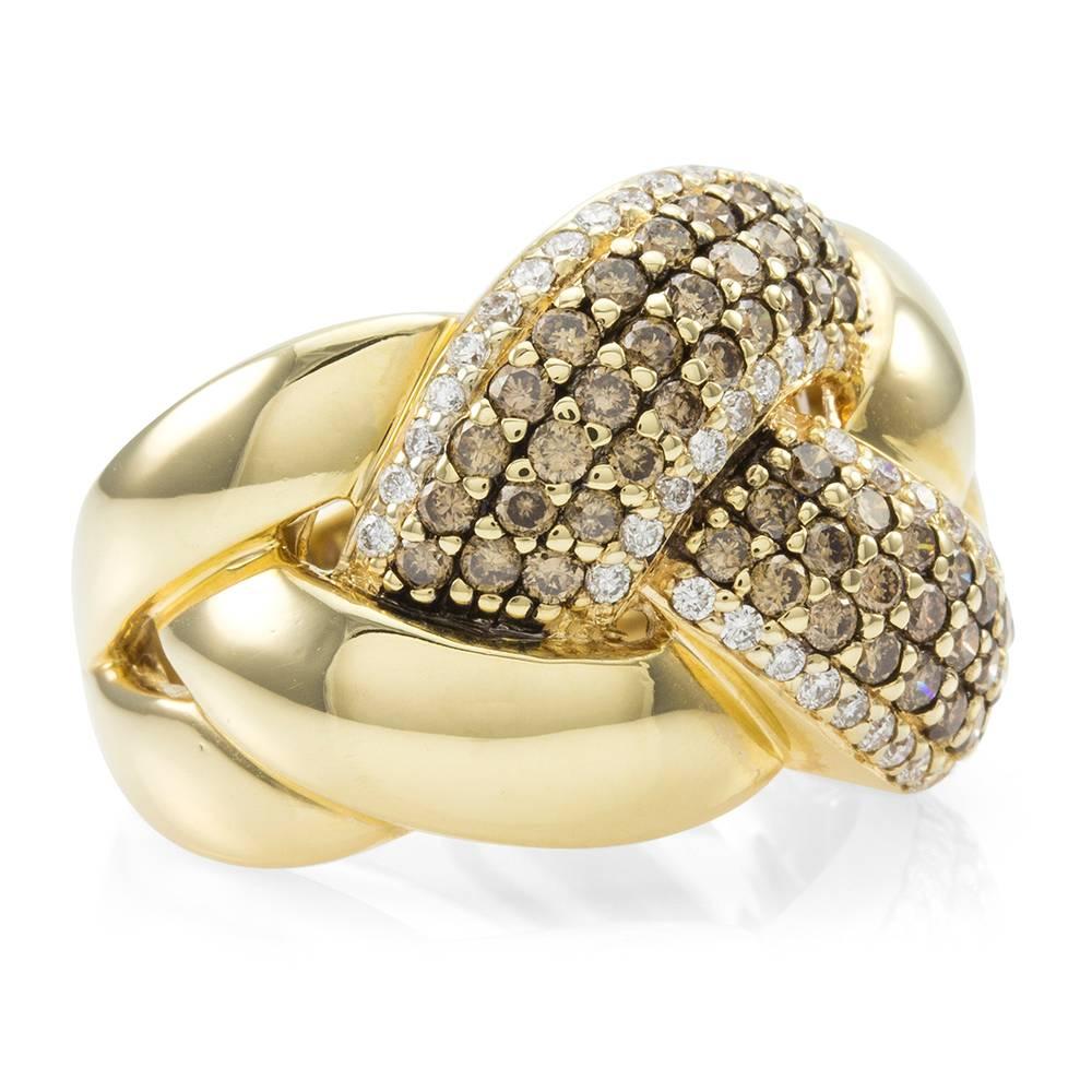 Signed designer Levian chocolate diamond braided knot ring in high polished 14K yellow gold. There are one hundred thirty- eight round brilliant cut chocolate/ brown diamonds (2.34ctw) bead set in 14K yellow gold. There are forty- eight  round