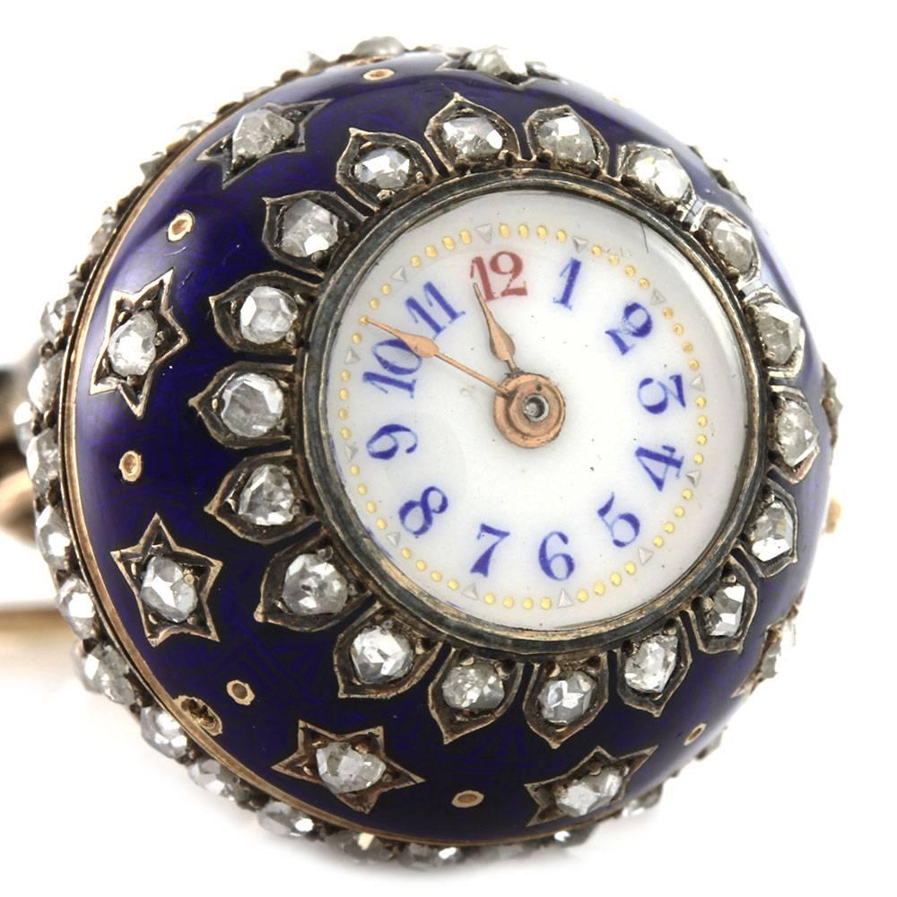 Antique rose cut and European cut diamond blue enamel orb ball lapel watch set in 14K yellow gold and silver. There are eighty-nine rose cut diamonds (1.45ctw), nine European cut diamonds (0.22ctw), and six round white seed pearls (2.5mm-3.5mm). The