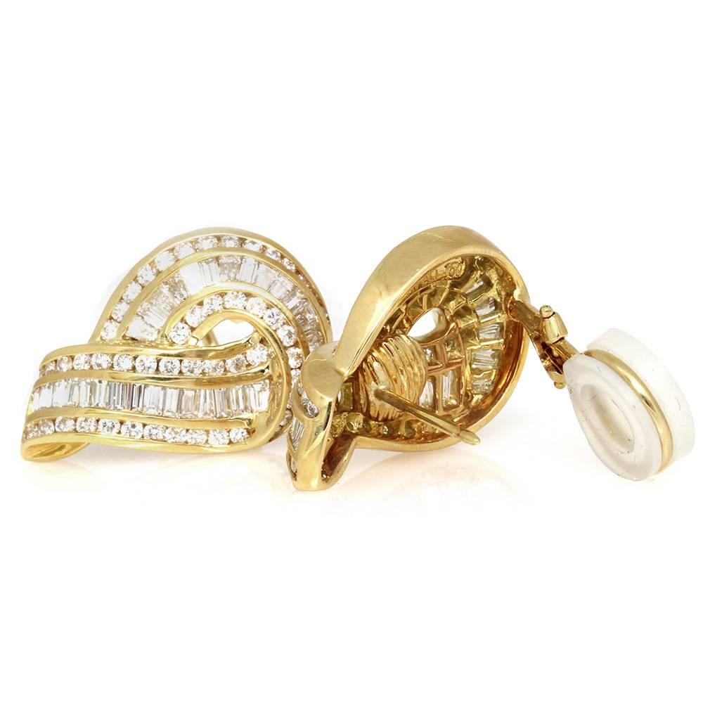 Charles Krypell mix cut diamond swirl earrings set in 18K yellow gold. There are ninety-eight round brilliant cut diamonds (1.80ctw) and sixty-six tapered baguette cut diamonds (3.96ctw) with a color of G-H and a clarity of VS. The diamonds are