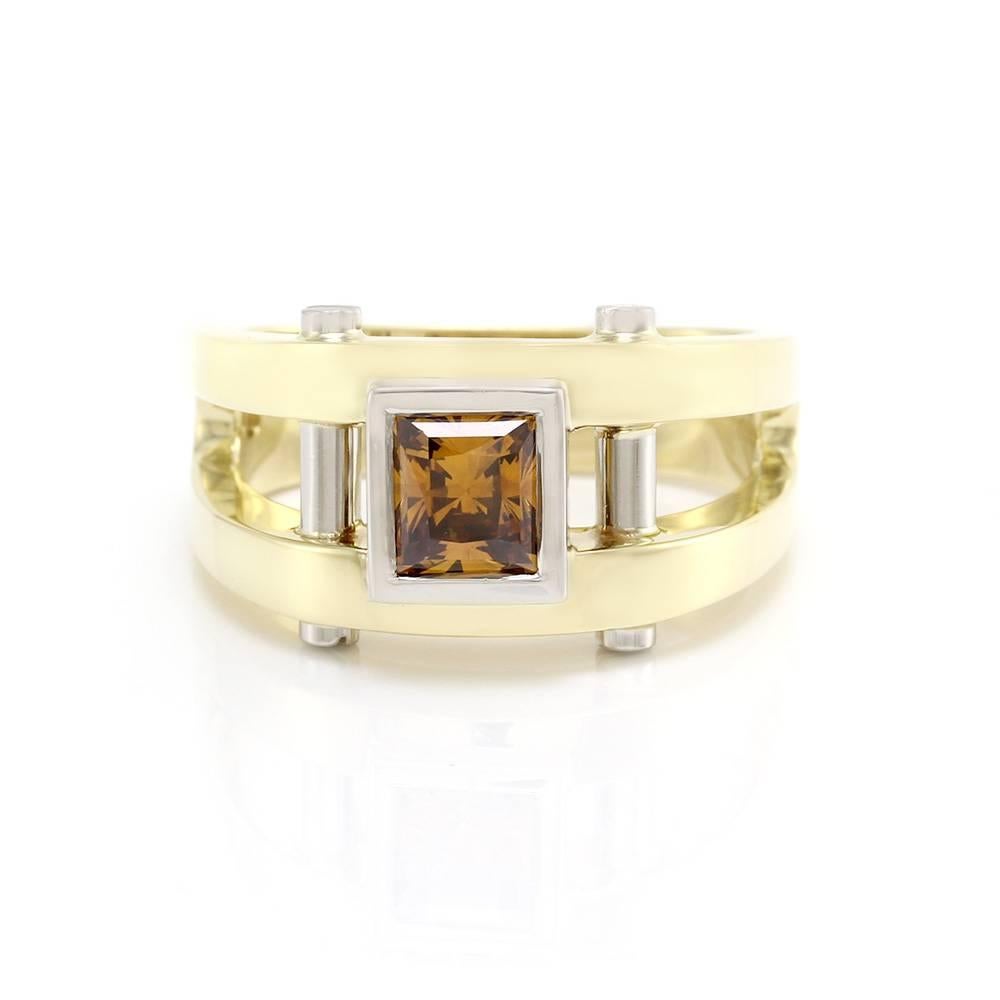 Signed designer Coffin & Trout contemporary men’s ring with a cognac diamond solitaire in 18K yellow gold and platinum. There is one princess cut cognac diamond (1.25ct) with a golden-yellowish brown color. The diamond is bezel set in high polished
