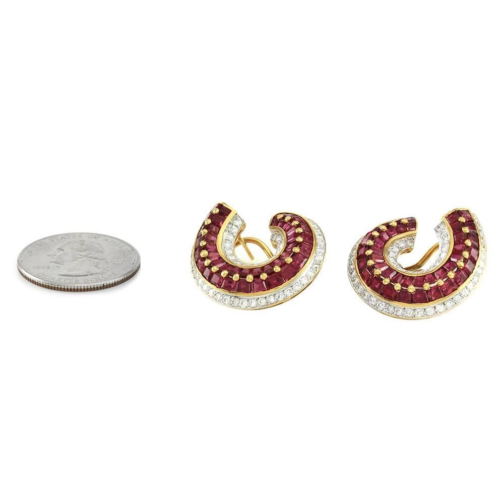 Genuine ruby and diamond wrap earrings set in 18K yellow gold. There are eighty tapered baguette cut rubies (1.00ctw) and one hundred eight round brilliant cut diamonds (1.58ctw) with a color of G-H and a clarity VVS-VS. The rubies are set in a