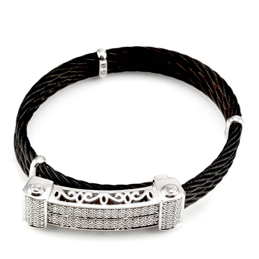 Signed designer Charriol Celtic Noir pave diamond station black cable bracelet with station set in 18K white gold. There are ninety-six round brilliant cut diamonds (0.48ctw) with a color of G-H and a clarity of VS2-SI1. The diamonds are bead set in
