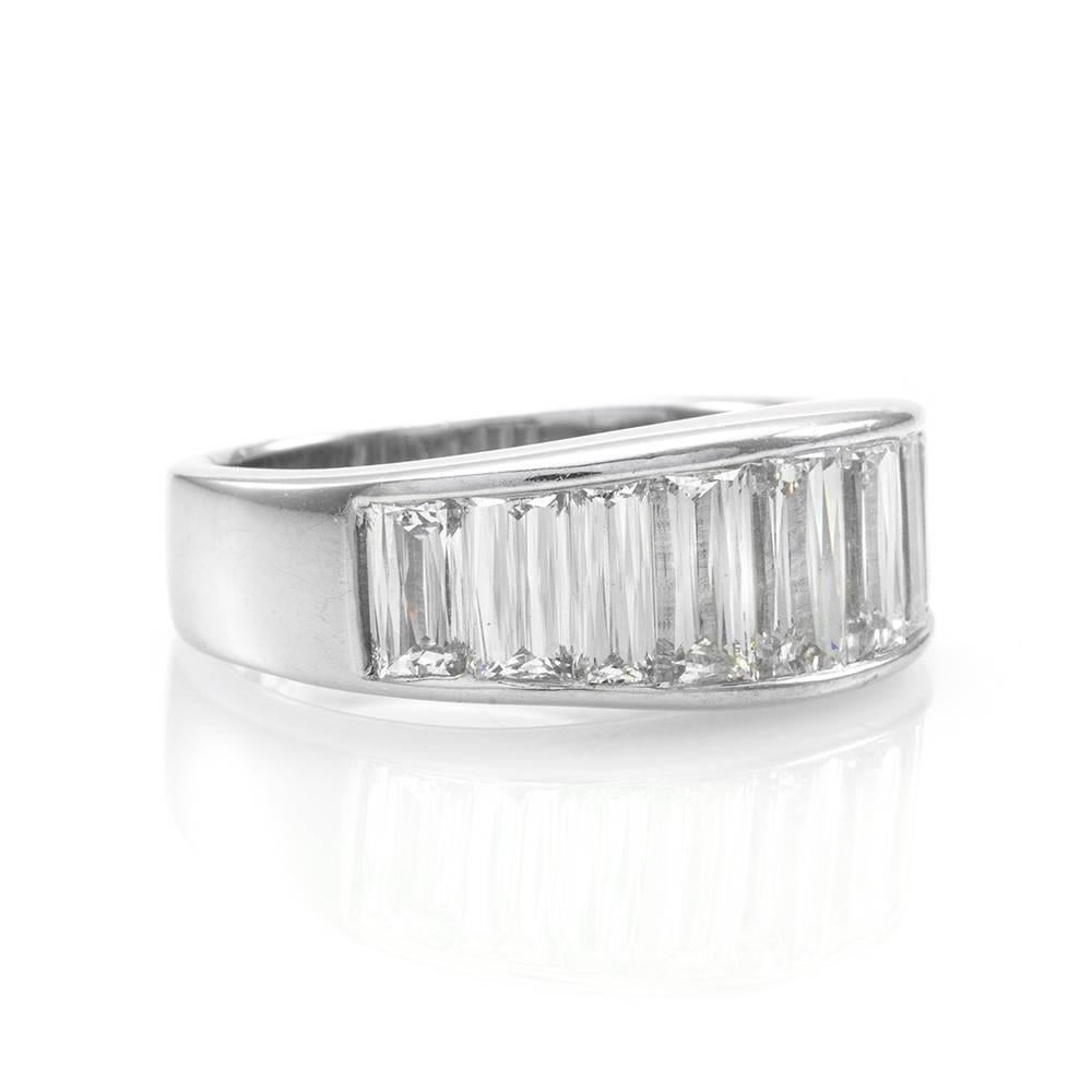 Christopher Designs Crisscut baguette anniversary band/ ring in high polished platinum. There are nine crisscut baguette cut diamonds (2.87ctw) with a color of G and a clarity of VS1. The overall size of this ring is (Embellishment) 7.7mm x 19.5mm,