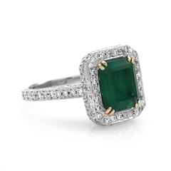 Vintage Colombian Emerald, Platinum, and Gold Halo Ring with Diamond Accents