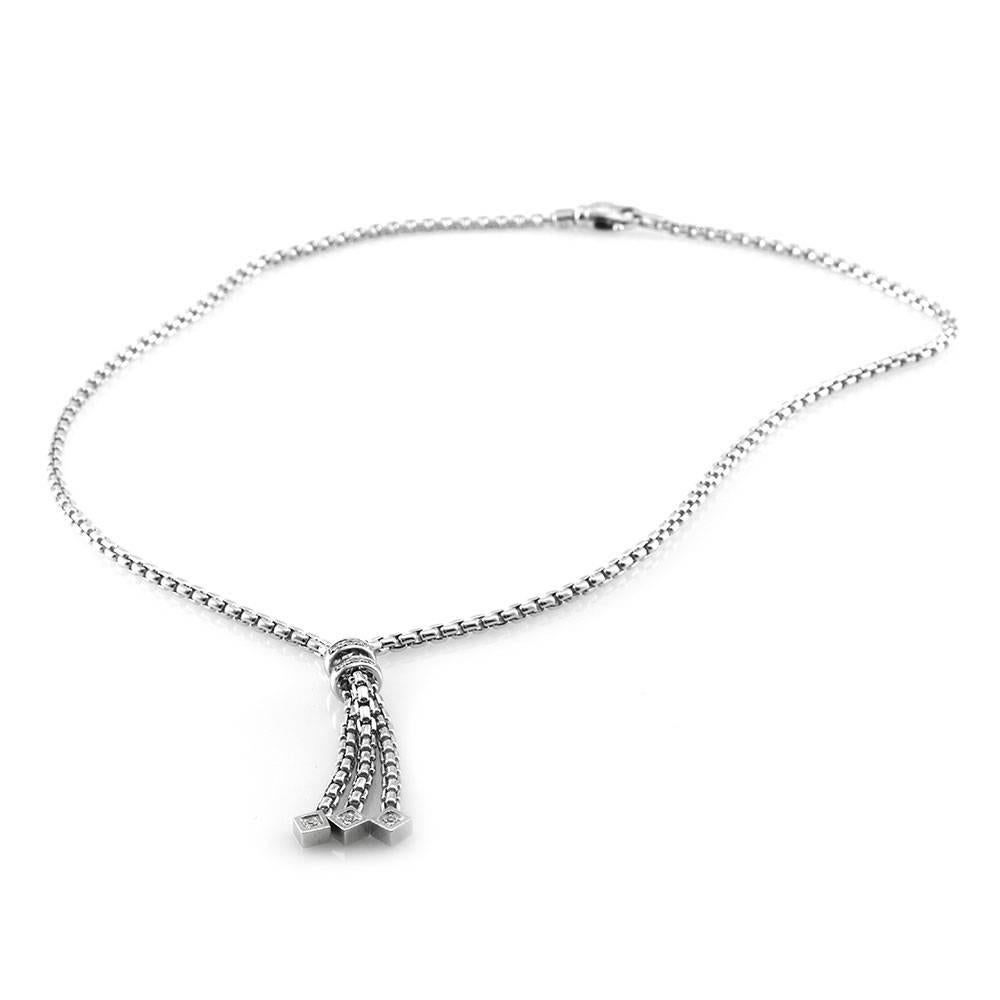 Signed designer Fope pavé diamond lariat style necklace set in 18K white gold. There are nine round brilliant cut diamonds (0.06ctw) with a color of G-H and a clarity of VS1. The diamonds are bead set in high polish 18K white gold. The dangle