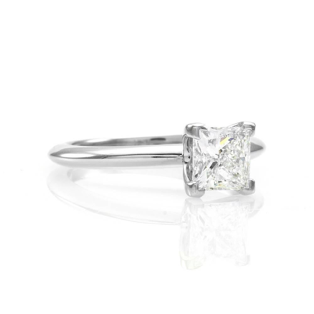 Tiffany & Co. princess cut diamond solitaire engagement ring with matching band set in platinum. There is one princess cut diamond (1.09ct) with a color of G and a clarity of VS1. The diamond is v-prong set in high polish platinum. The overall size