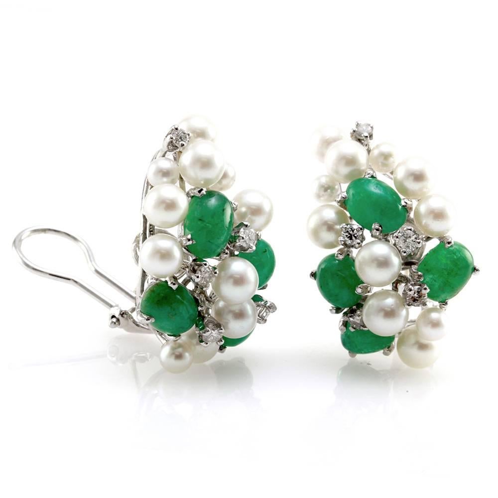 Emerald and white pearl earrings with diamond accents in high polished 14K white gold. There are eight oval cabochon cut emeralds (8.80ctw) and ten round brilliant cut diamonds (0.45ctw) with a color and clarity of G-H, I2. There twenty-two pearls